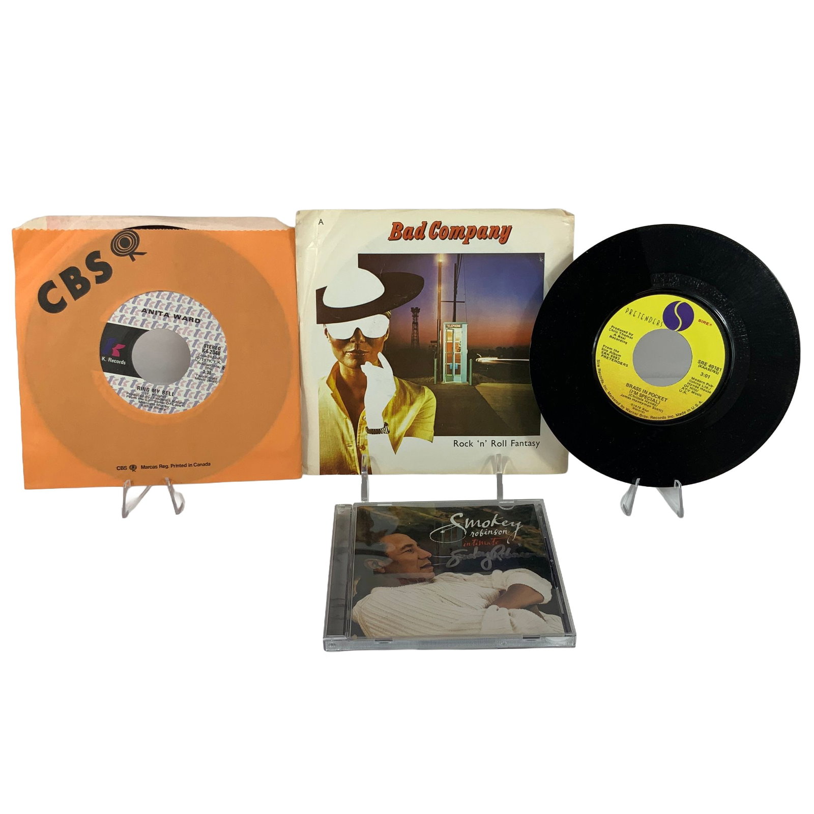 Smokey Robinson Autographed CD & 3 vintage 45 RPM Hit Pop singles: This collection features three 7-inch 45 RPM vinyl records and one compact disc. The vinyl selection includes Anita Ward's 1979 single Ring My Bell released under T.K. Records and CBS, catalog number 