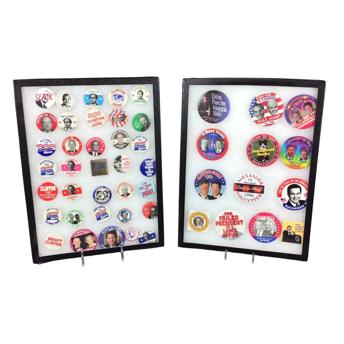Collection of 1990s US Presidential Campaign Buttons and Pins in 2 Tray Display Cases: This collection of 1990s US political campaign memorabilia is presented as a 2 tray pin set within two black-framed display cases. The assortment primarily focuses on the 1992 and 1996 presidential el