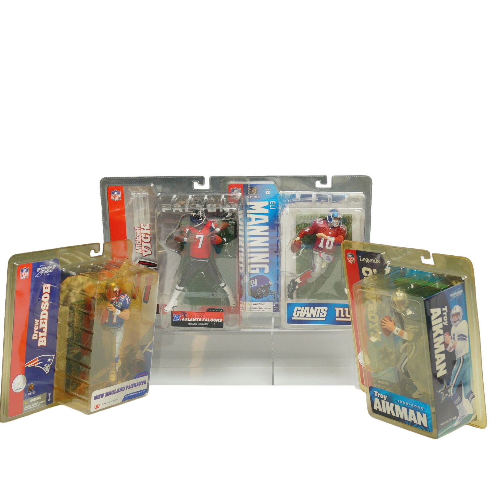 4pc Lot of McFarlane Toys NFL Sportspicks Action Figures in Original Packaging: This lot features a collection of 4pc NFL figurines in boxes manufactured by McFarlane Toys as part of their Sportspicks line. Each figure is unopened and housed in its original factory blister pack w