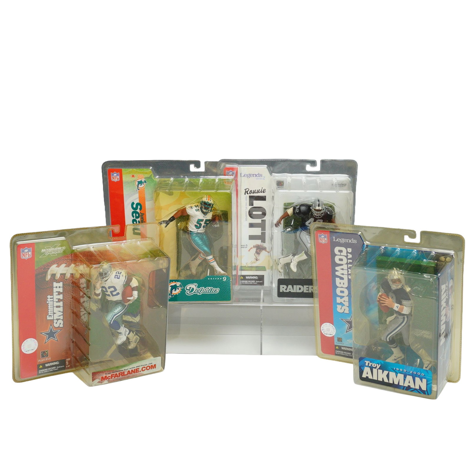 4pc Lot of McFarlane Toys NFL SportsPicks and Legends Series Action Figures: This collection consists of four NFL action figures manufactured by McFarlane Toys, presented in their original factory blister packaging. The group includes figures from both the NFL SportsPicks and 