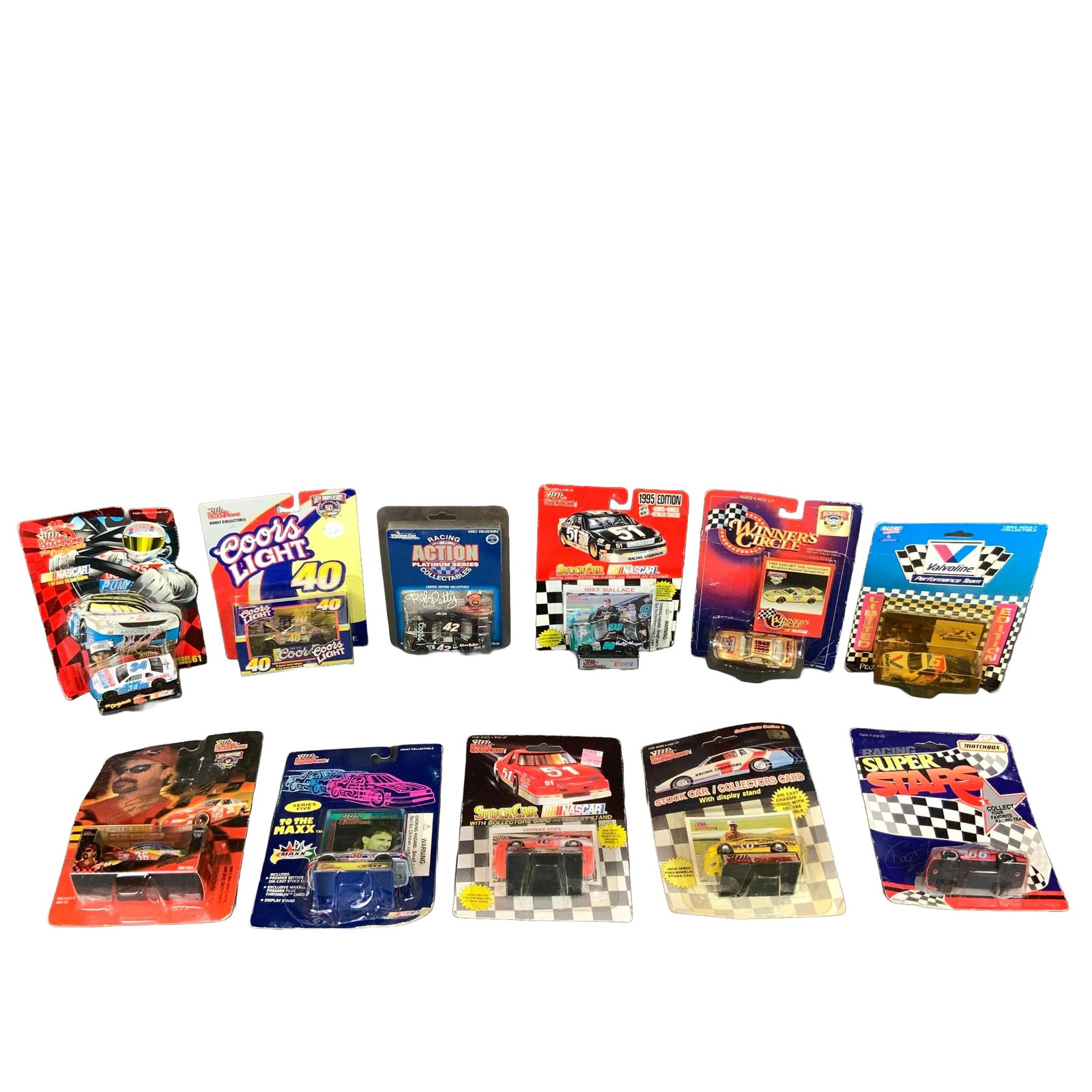 A Collection of 11 Vintage NASCAR Die-Cast Model Cars: This lot consists of 11 vintage NASCAR die-cast model cars in their original retail blister pack packaging, primarily in 1:64 scale. The collection features a variety of prominent drivers, teams, and 