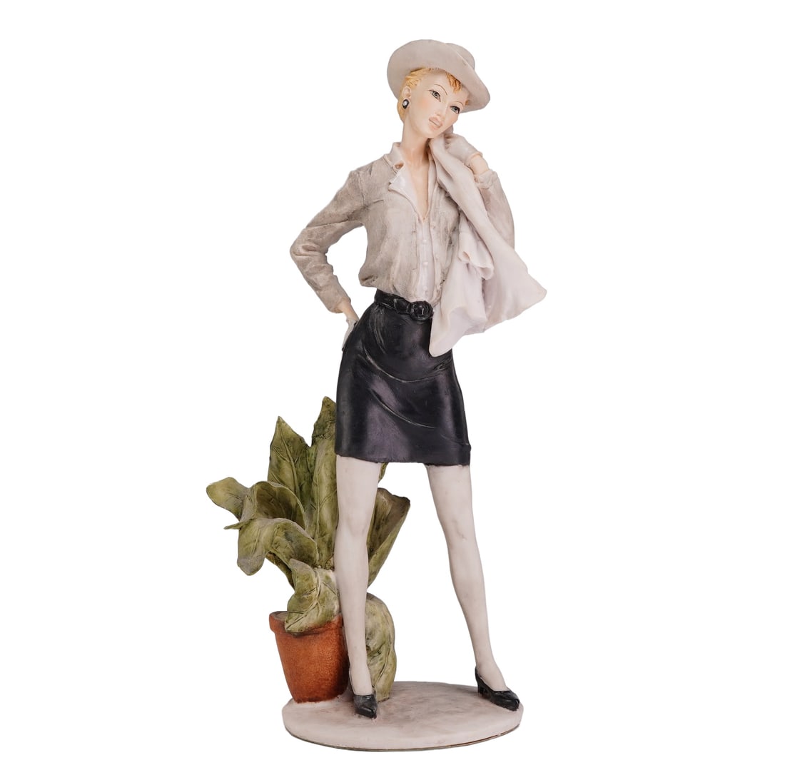 Arnart Imports Emilio Pucci Fashion Model Figurine: This resin figurine, part of the Pucci series produced for Arnart Imports, depicts a woman in mid-twentieth-century fashion. The figure is posed with her right hand on her hip and a light-colored jack