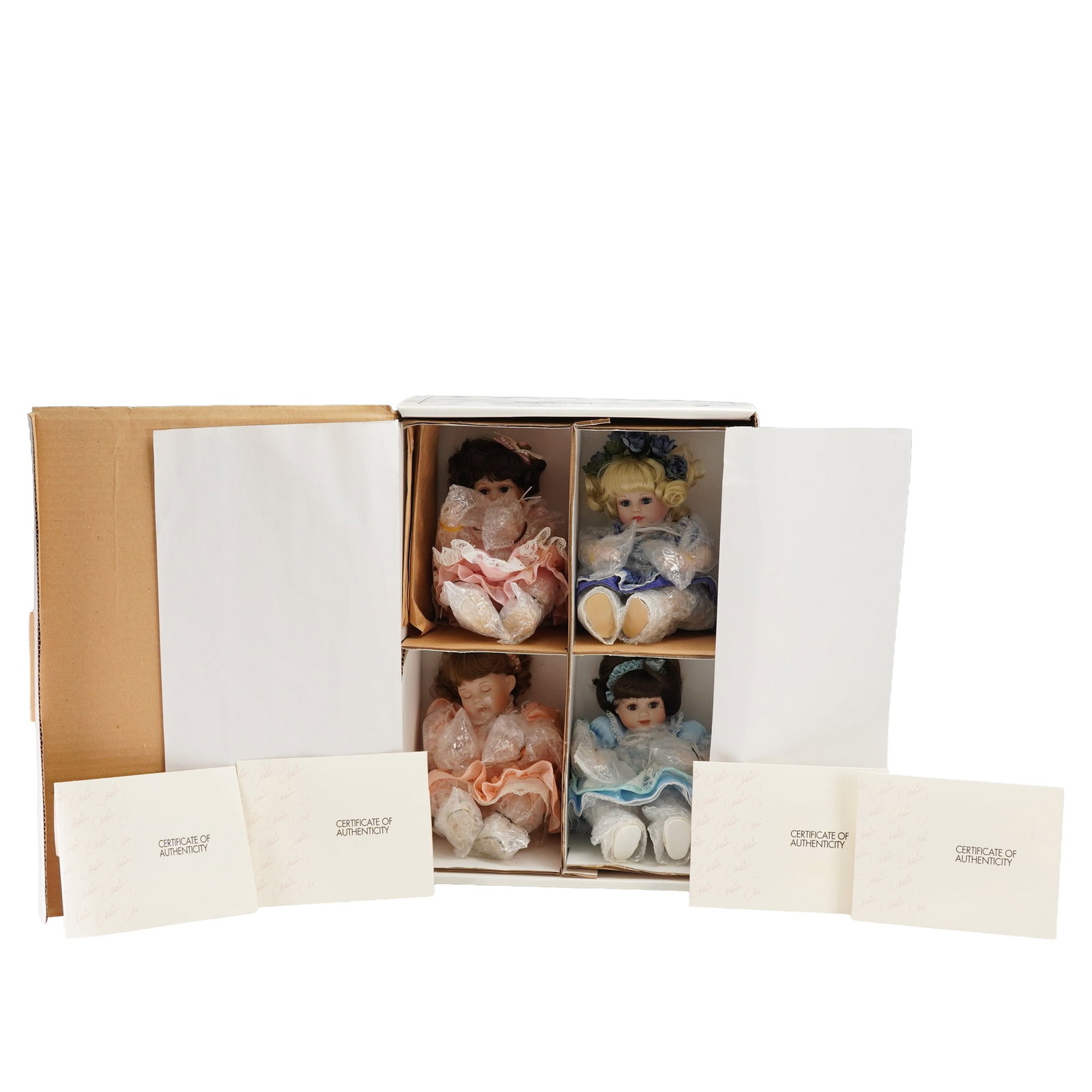 4pc Marie Osmond Tiny Tots Porcelain Dolls: Set of four Marie Osmond Fine Porcelain Tiny Tots collector dolls, each hand-numbered and part of a limited edition series. Includes Baby Marie, Olive May, Ashley, and Baby Alexis dolls, each with cer