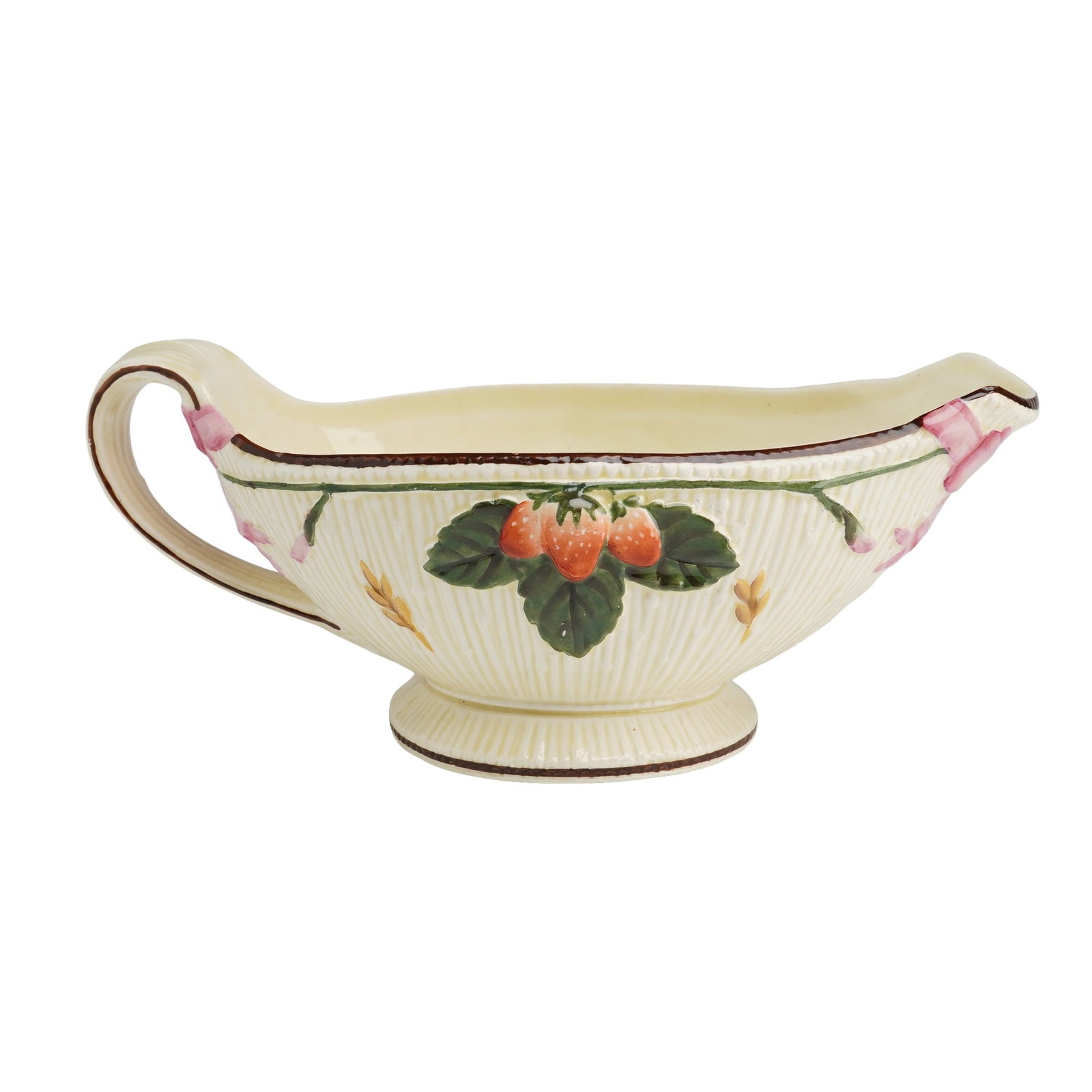 Wedgwood Gravy Boat with Fruit and Bow Motifs: This Wedgwood gravy boat is constructed from cream-colored earthenware featuring a reeded texture and molded, hand-painted decoration. The exterior is adorned on each side with a cluster of three stra