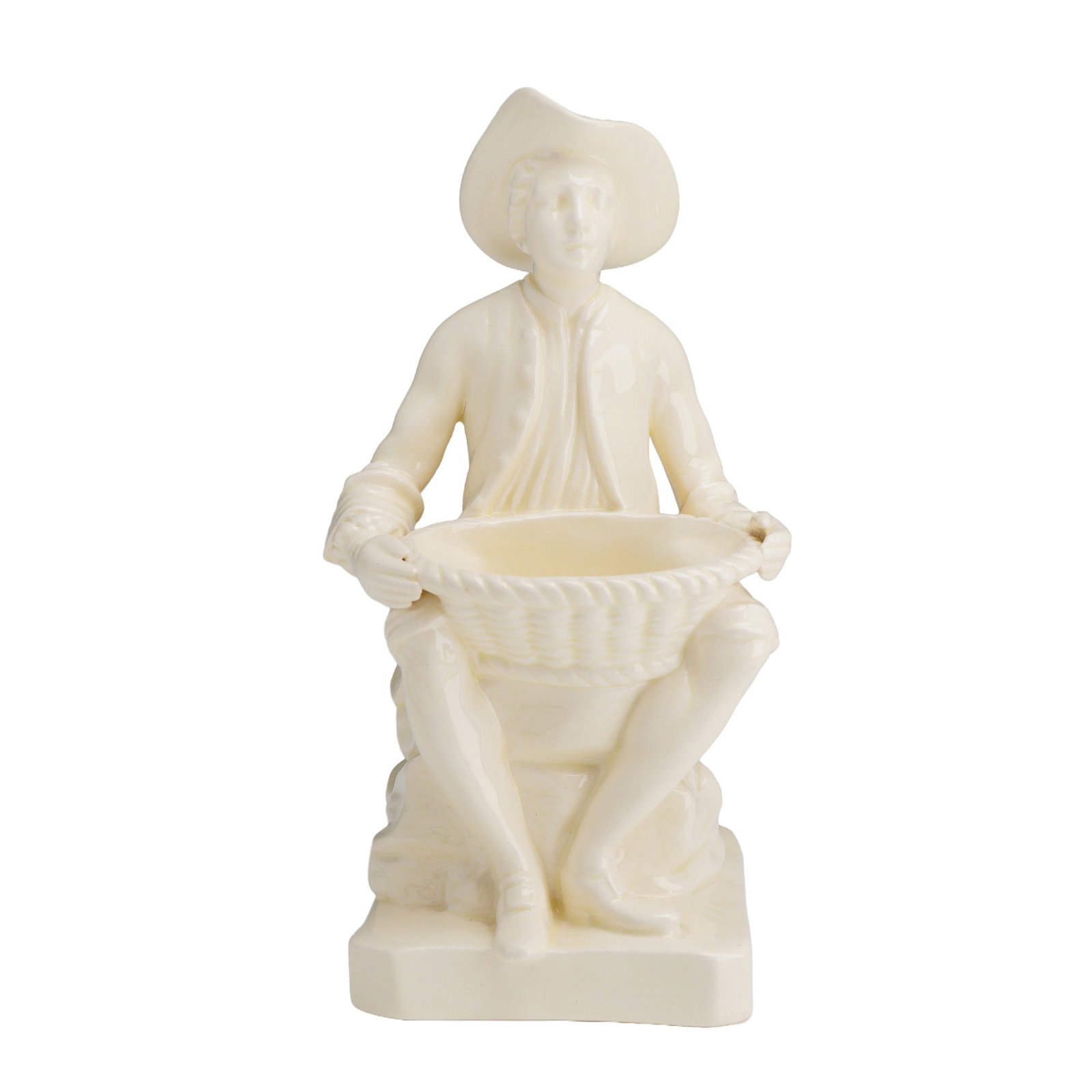 Wedgwood Etruria Creamware Seated Figure Sweetmeat Dish: A Wedgwood creamware figural sweetmeat dish from the Rubin Collection. The piece depicts a seated male figure dressed in 18th-century attire, including a wide-brimmed hat, a buttoned waistcoat under a