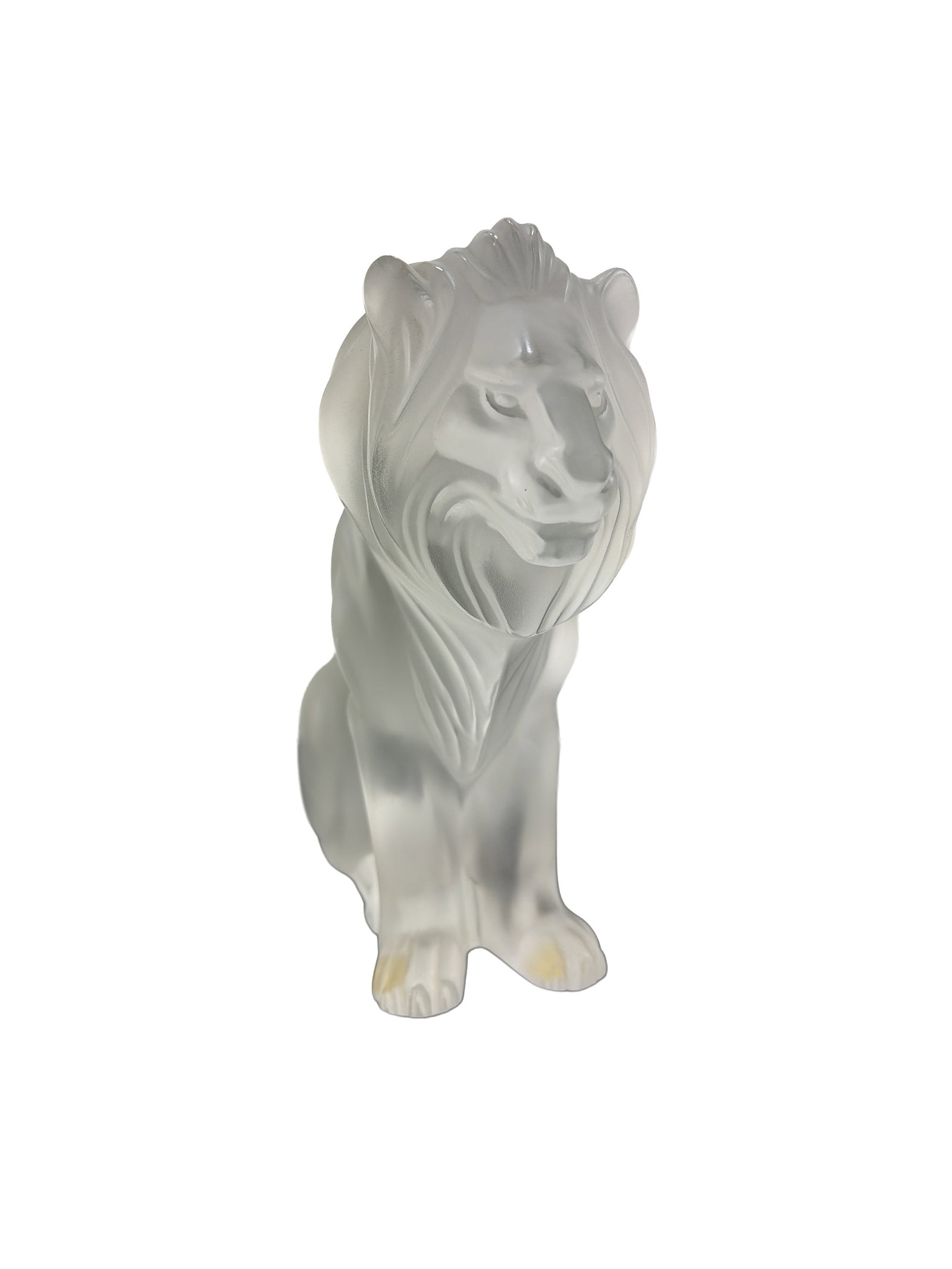 Lalique Frosted Crystal Lion: Lalique, France. Figurine in frosted clear crystal depicting a seated lion. The stylized figure features a flowing, textured mane and muscular anatomical definition. Etched signature to the underside 