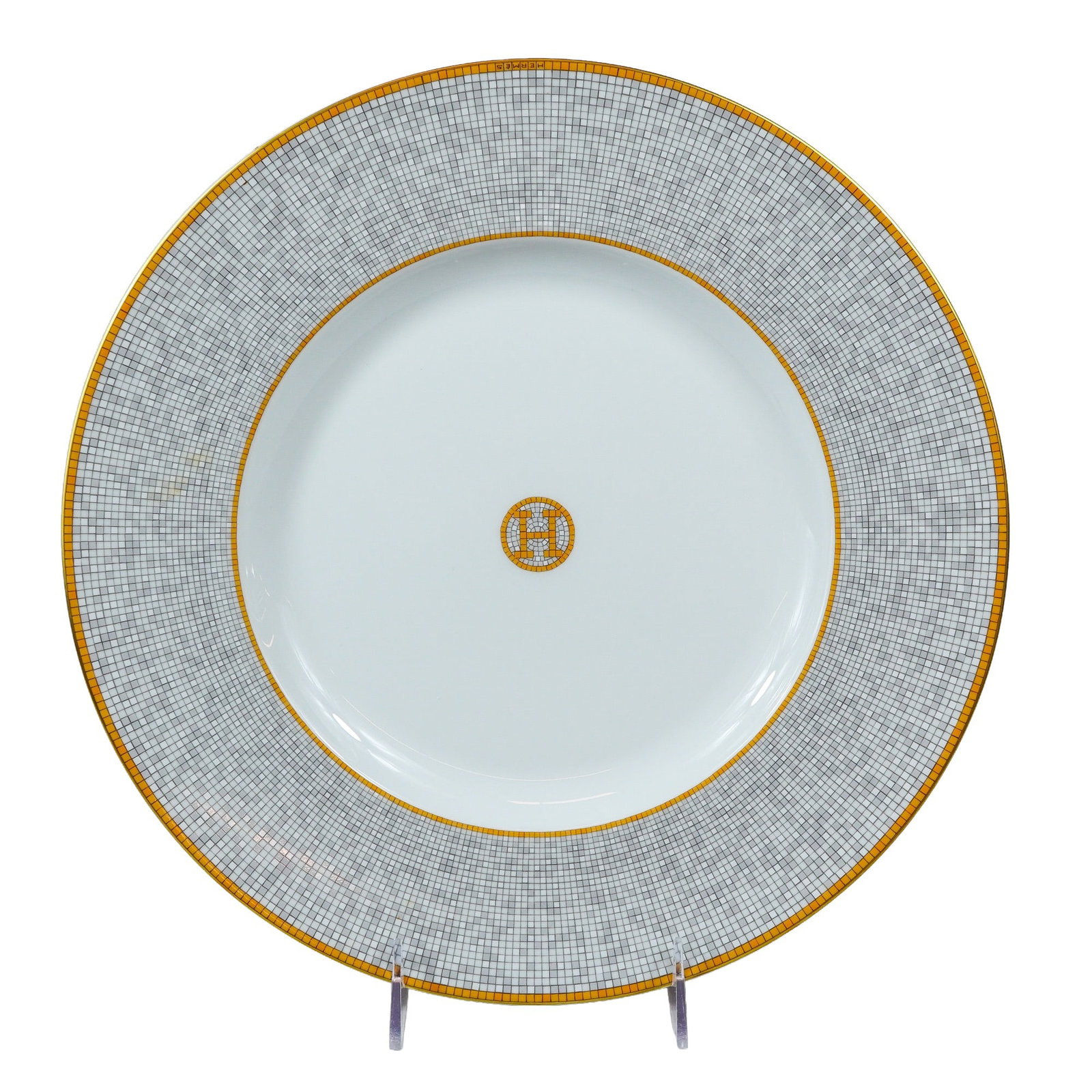 Hermes Mosaique au 24 Gold Porcelain Presentation Plate: Hermes porcelain presentation plate in the Mosaique au 24 pattern. This piece features a geometric mosaic pattern in ochre and grey tones, inspired by the Art Deco decor of the 24 Faubourg Saint-Honor