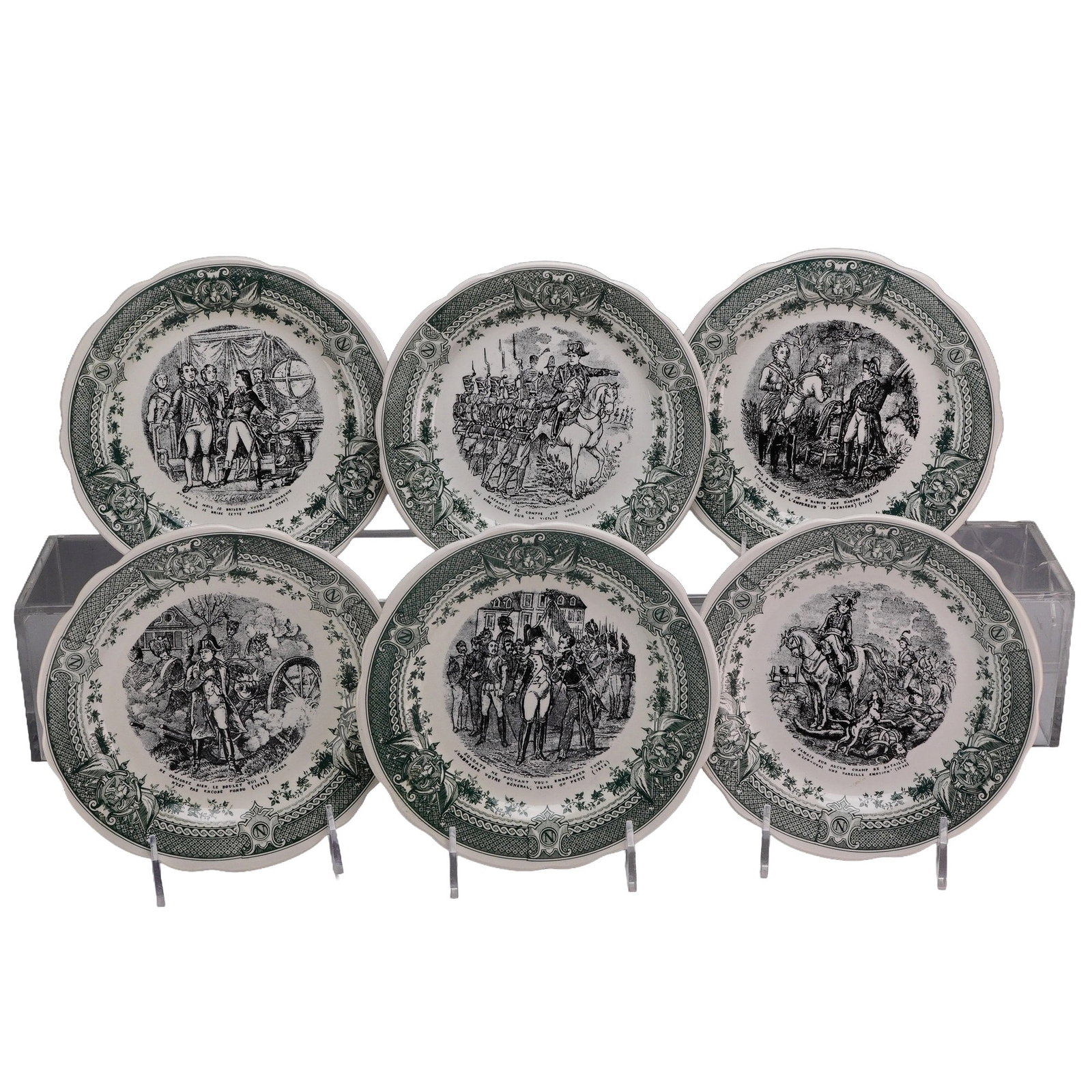 6pc Sarreguemines France Napoleon Bonaparte Story Plates: This lot of 6 Sarreguemines France story plates features transfer-printed scenes from the life and military campaigns of Napoleon Bonaparte. Each glazed earthenware plate is decorated with a central b
