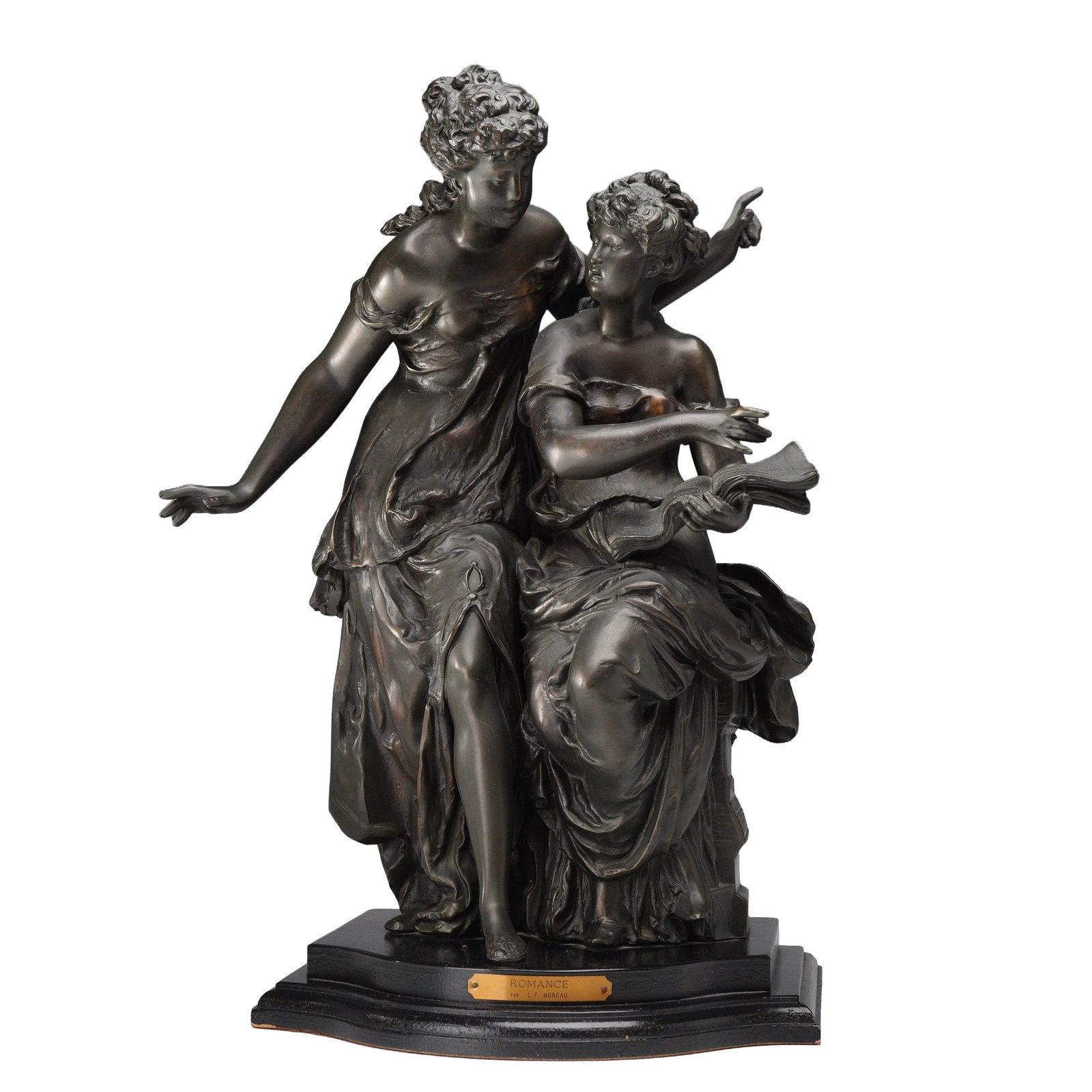 After Louis-Francois Moreau Romance Sculpture: After Louis-Francois Moreau. Cast metal sculpture with a dark bronze-toned patina titled Romance, depicting two neoclassical female figures, one seated with an open book and the other standing. Featur