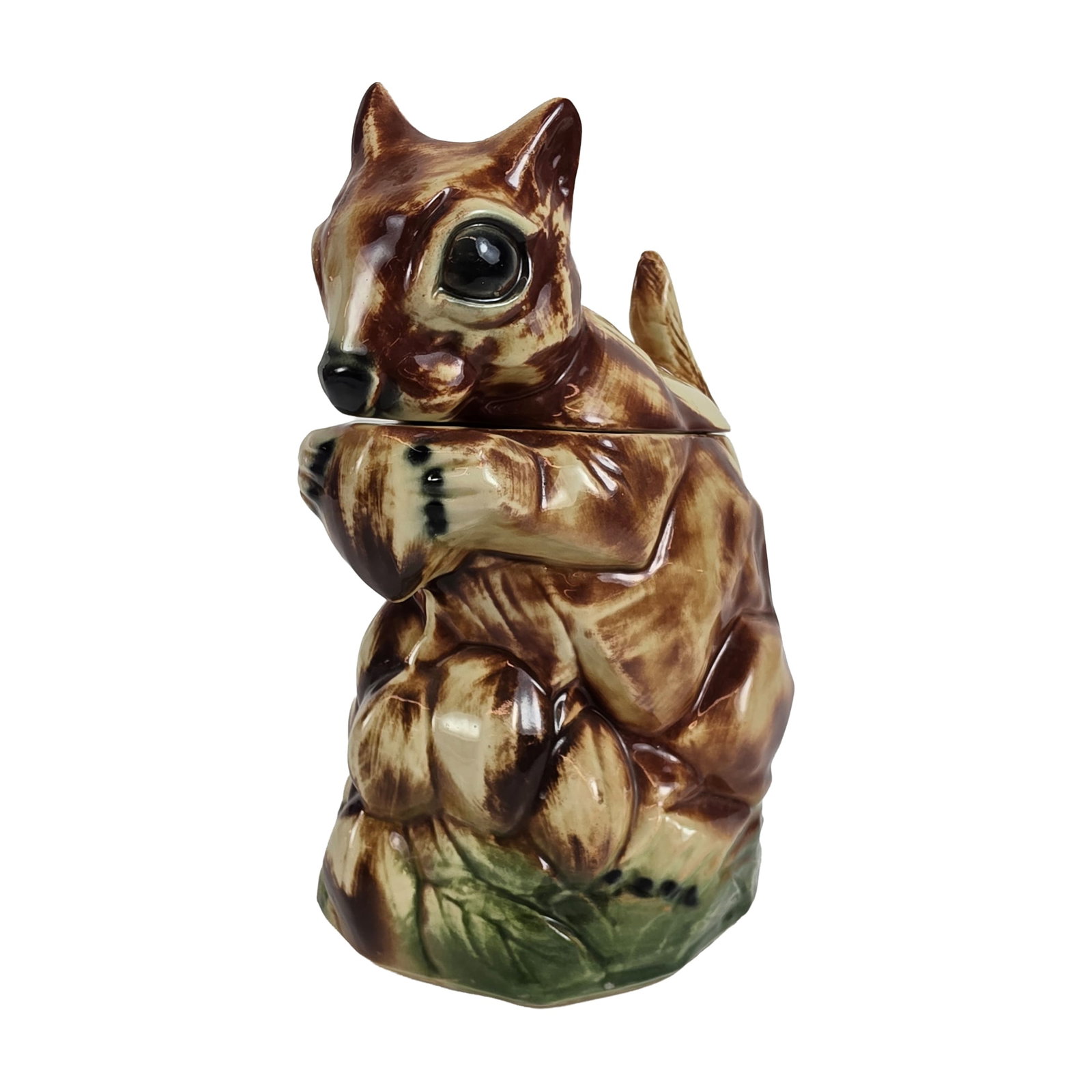 McCoy Pottery Ceramic Chipmunk Novelty Cookie Jar: A mid-century novelty cookie jar in glazed ceramic, modeled in the form of a reclining chipmunk. The two-piece construction features a lid comprising the head and front paws, with the base forming