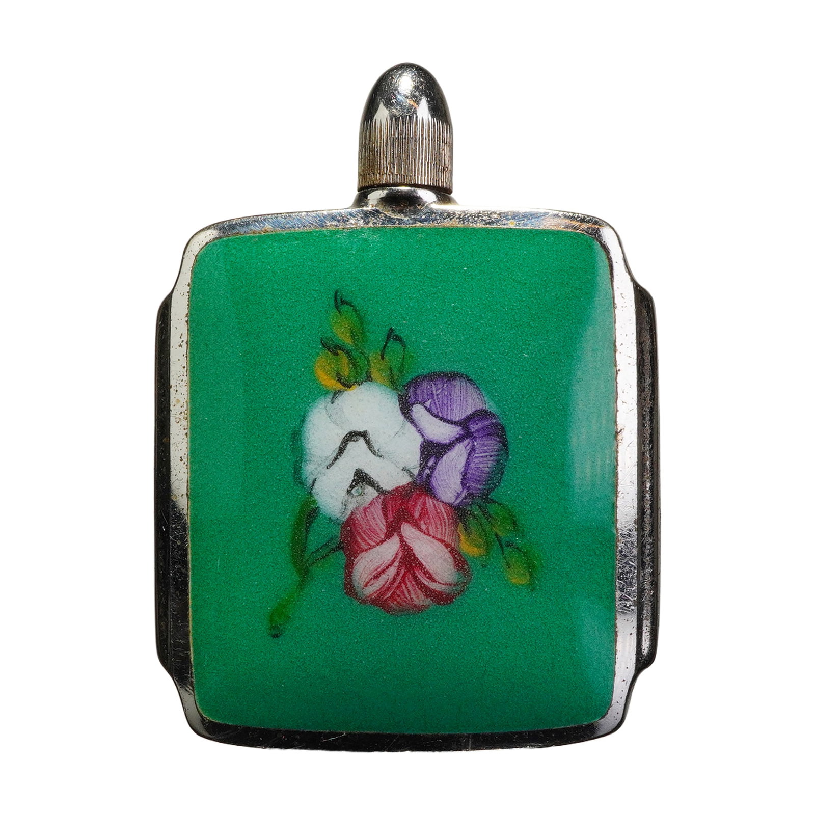 Sterling Silver and Enamel Floral Snuff Bottle: A sterling silver and enamel snuff bottle featuring a square body with stepped sides. The front is decorated with a panel of vibrant green enamel centered by a hand-painted floral bouquet in white,
