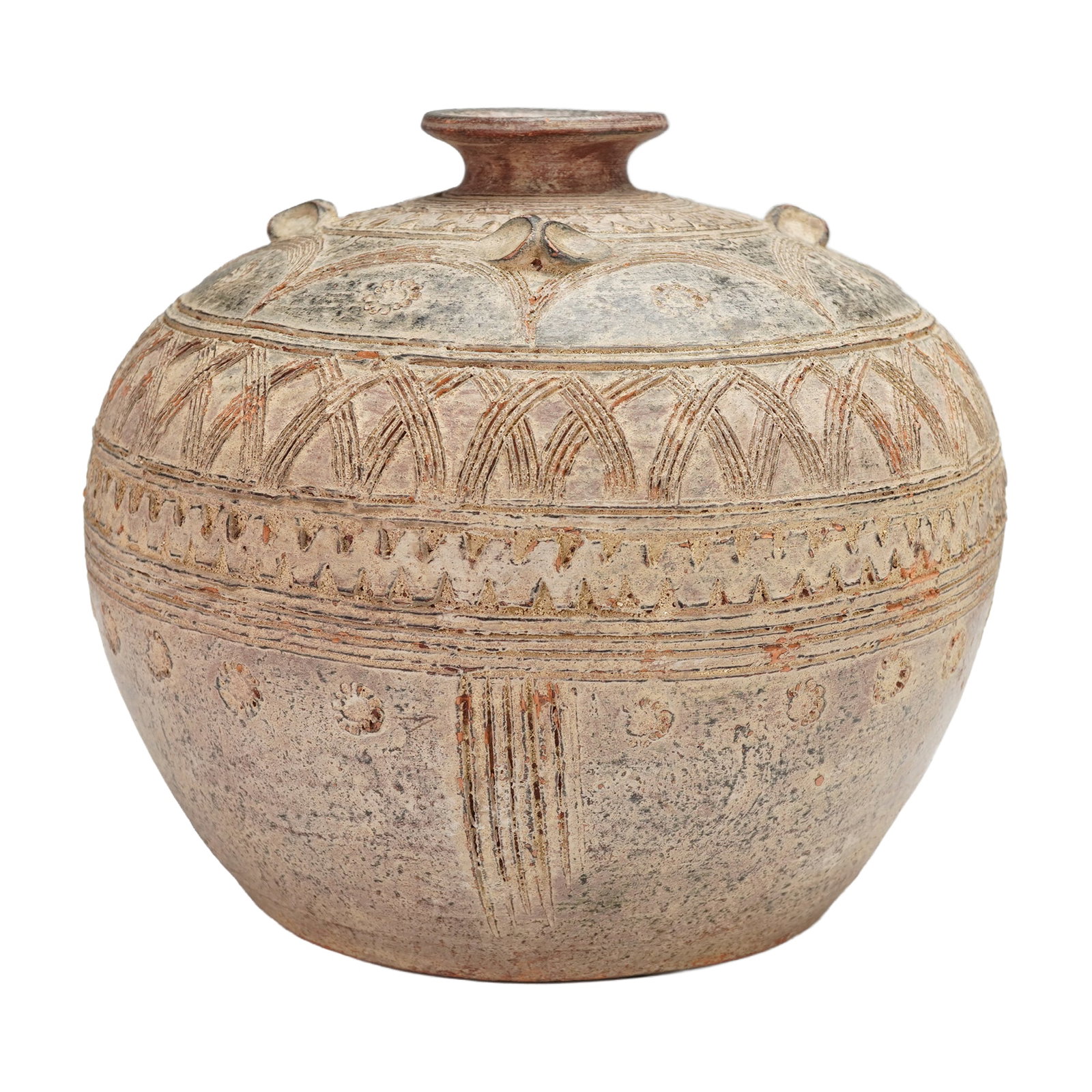 Carved Tribal Motif Pottery Vase: This rounded earthenware vase features a flared neck and carved geometric decoration including arches, zigzag bands, and dotted motifs, the surface showing natural weathered tones of stone, clay, and 