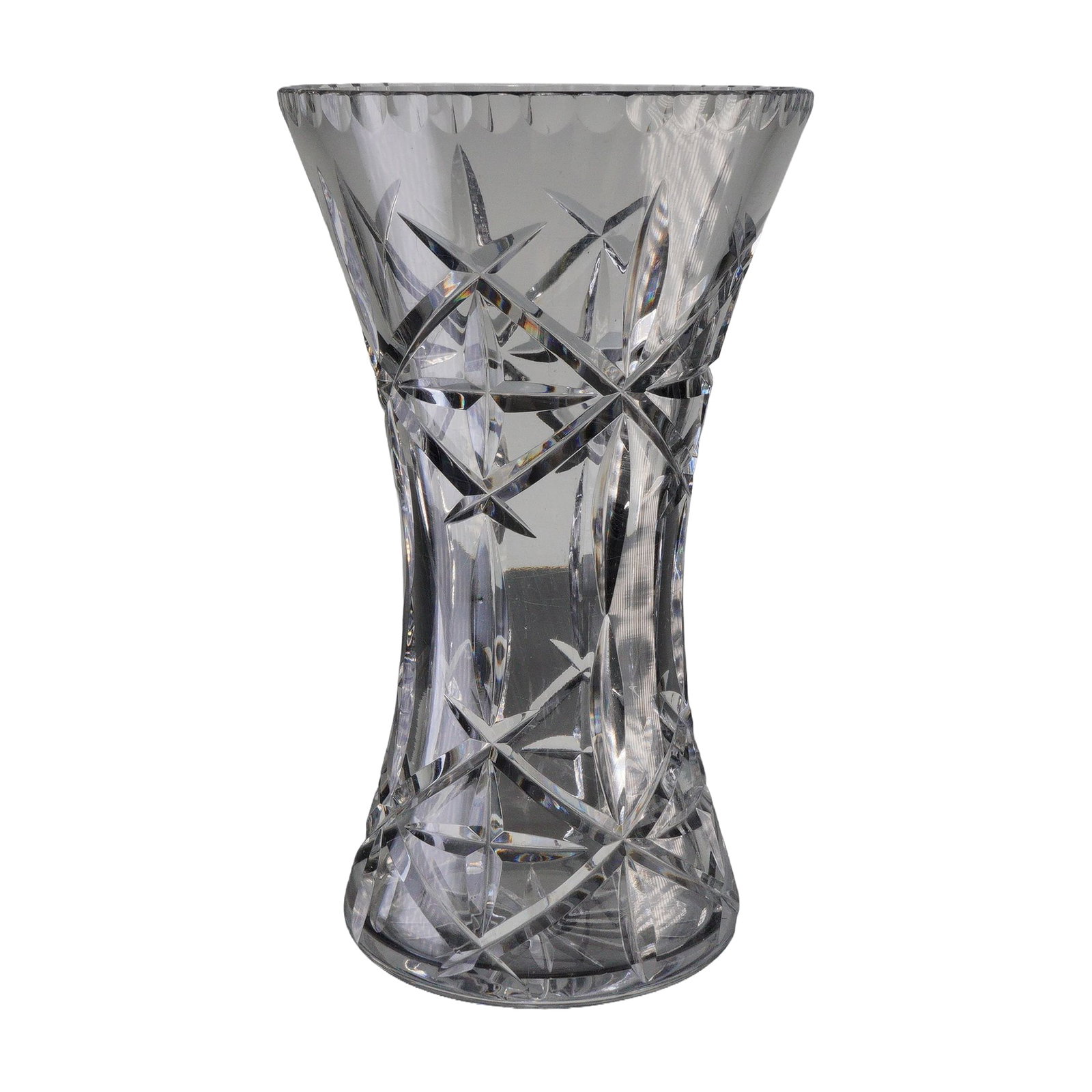 Crystal Starburst Vase: A clear cut-glass vase featuring a flared rim, tapered waist, and repeated starburst and leaf-form engraved motifs, with a radial star pattern adorning the base. Dimensions: 5.5"W x 9"H