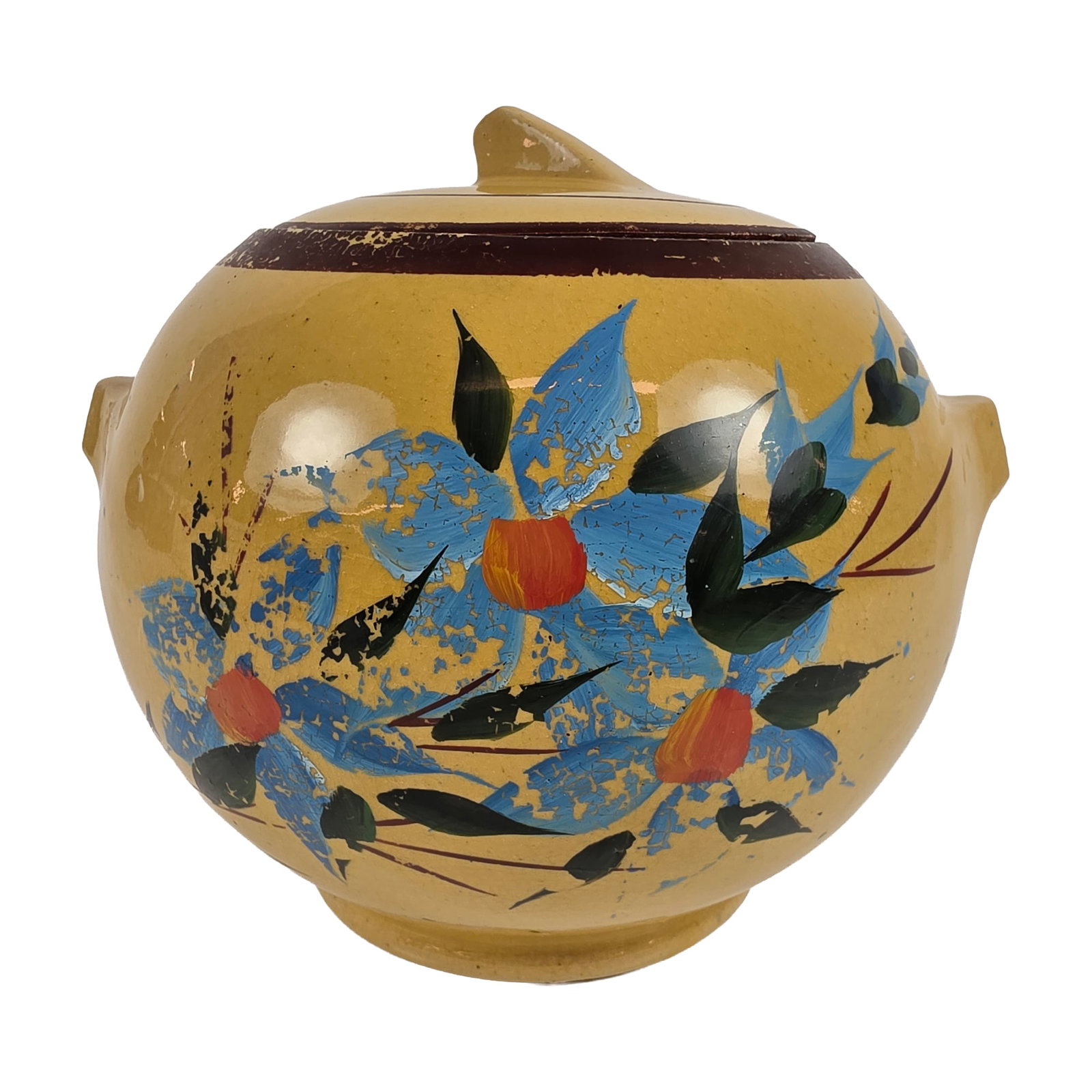 McCoy Ceramic Hand Painted Floral Cookie Jar: A hand painted ceramic cookie jar in a globular form, featuring two small integrated lug handles and a matching lid with a pointed finial. The vessel is finished in a yellow glaze and decorated with a