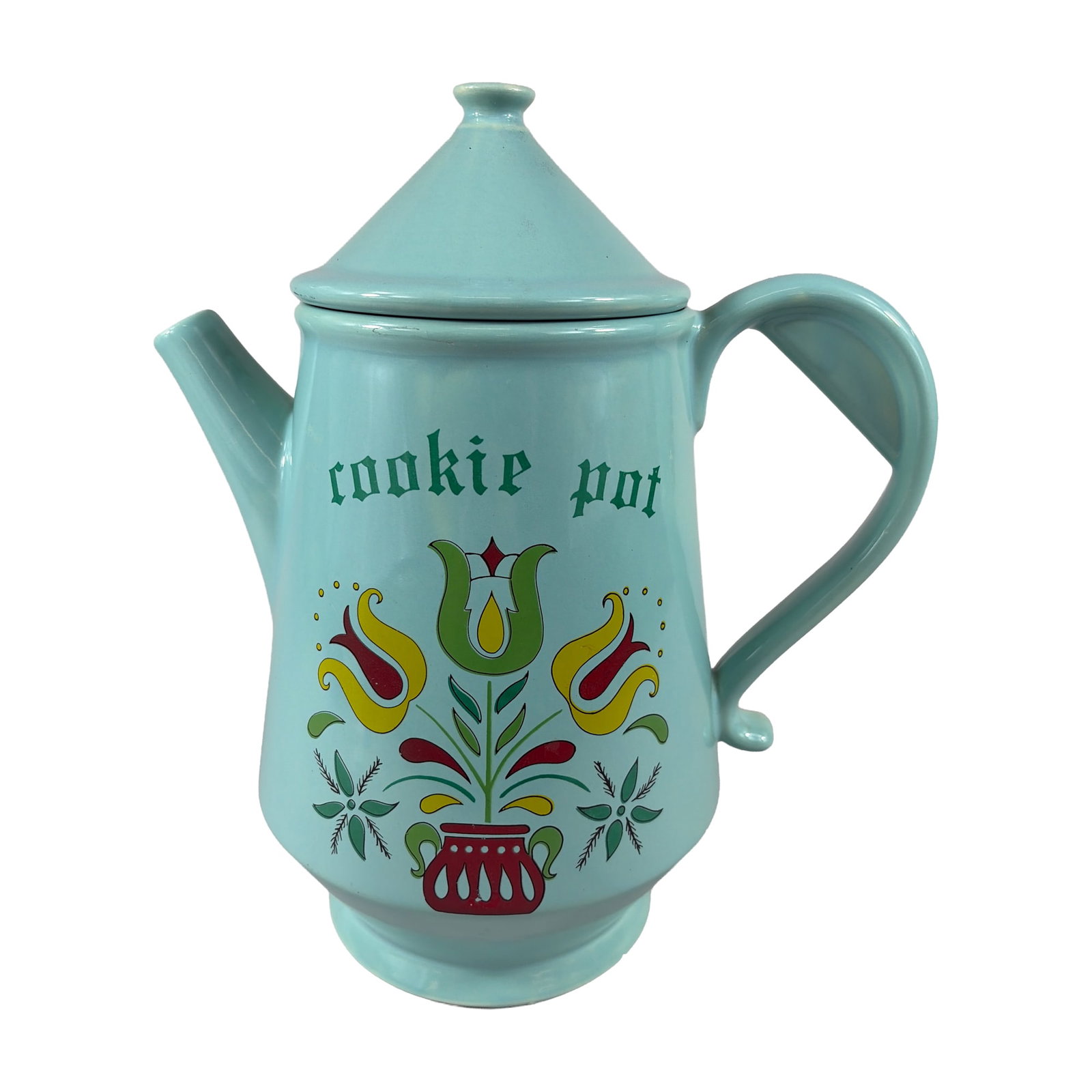 McCoy Pottery Pennsylvania Dutch Tulip Cookie Pot: McCoy Pottery Cookie pot featuring a tall tapered cylindrical form with an integrated D-shaped handle and a short pouring spout. The vessel is topped with a matching conical lid and a rounded knob fin
