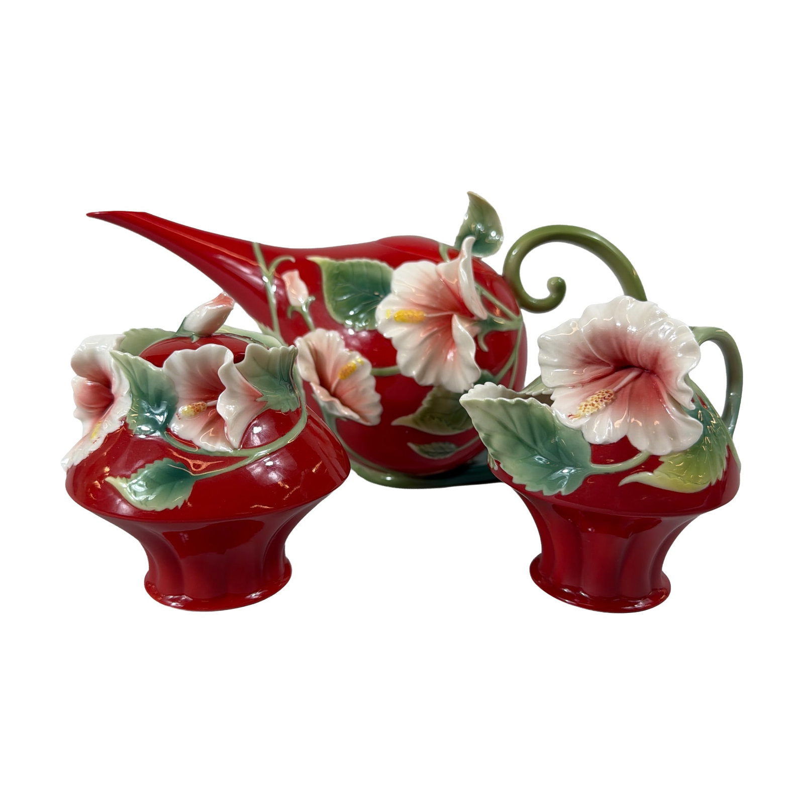3pc Franz Porcelain Island Beauty Ceramic Pieces: Franz Porcelain three-piece ceramic group in the Island Beauty pattern, designed by James Tsai, including a teapot, a lidded sugar bowl, and a creamer. Each piece is crafted in glazed porcelain with a