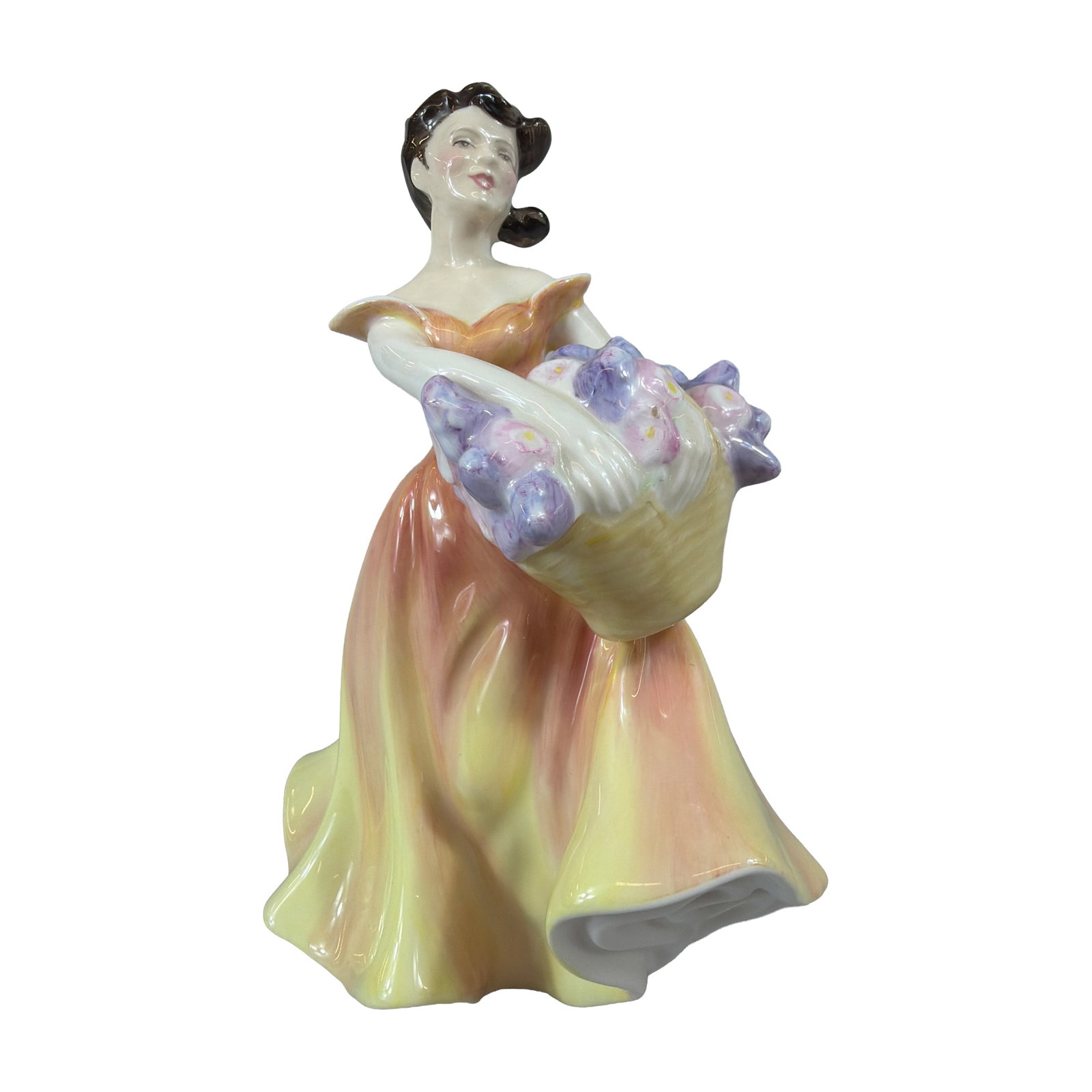 Royal Doulton Bone China Figurine, Lesley, HN 2410: Royal Doulton bone china figurine titled Lesley, model HN 2410. The piece depicts a standing woman with dark brown hair styled in waves, wearing an off-the-shoulder gown with a gradient color transiti
