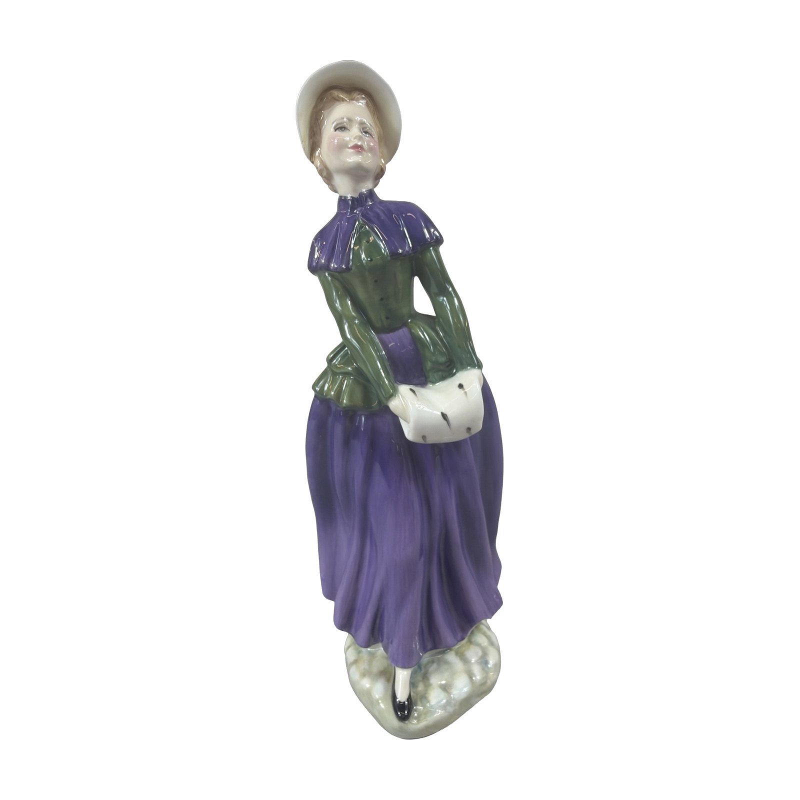Royal Doulton Florence Bone China Figurine HN 2745: Royal Doulton hand-decorated bone china figurine titled Florence, model HN 2745, modeled by Douglas V. Tootle. The figure depicts a woman dressed in Victorian-style winter attire, featuring a purple s