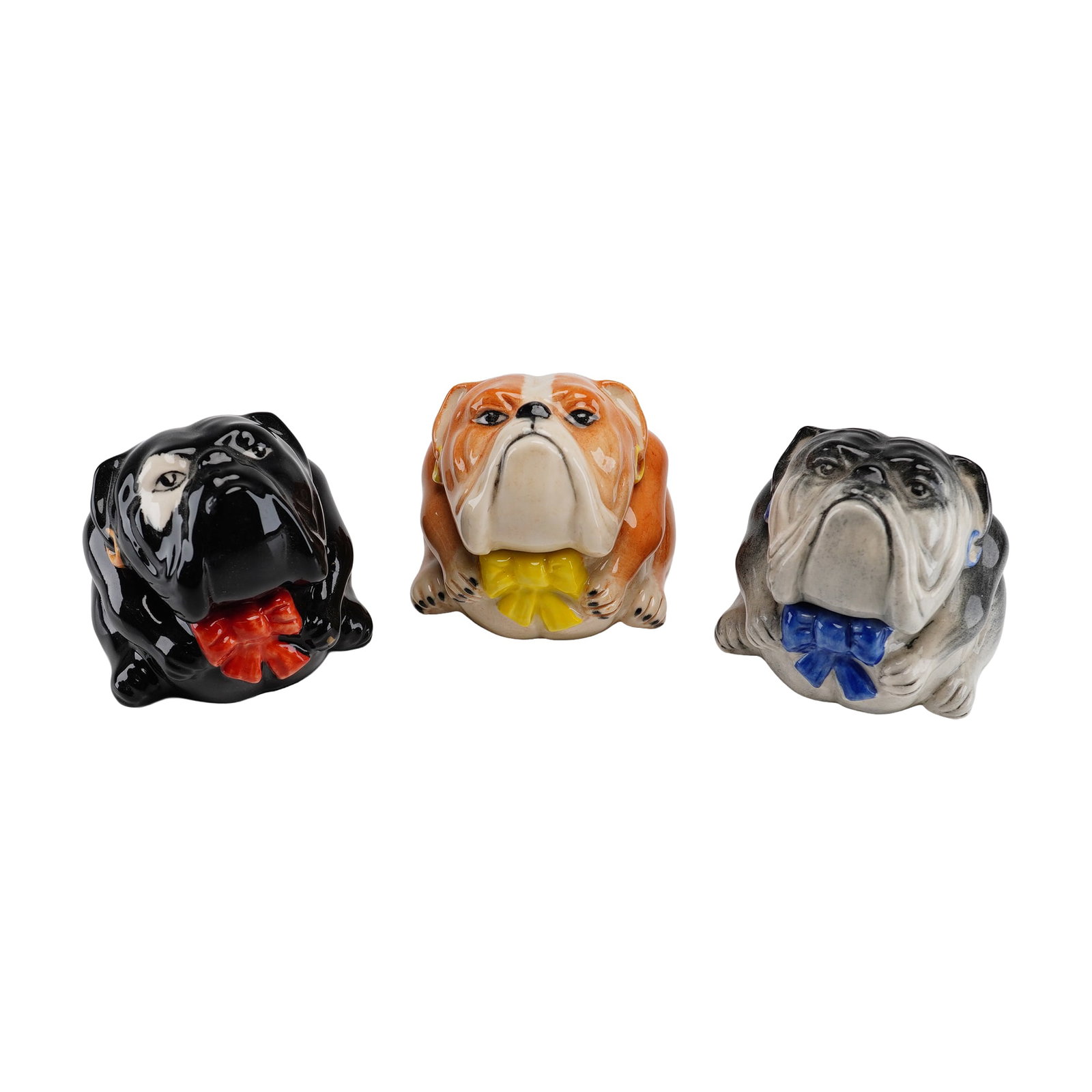Three Kevin Francis Face Pots Trinket Boxes, Bulldogs including Prototype: A collection of three glazed ceramic bulldog trinket boxes from the Face Pots series by Kevin Francis, produced in England. These items are modeled as the Bertie Bulldog character in three different c