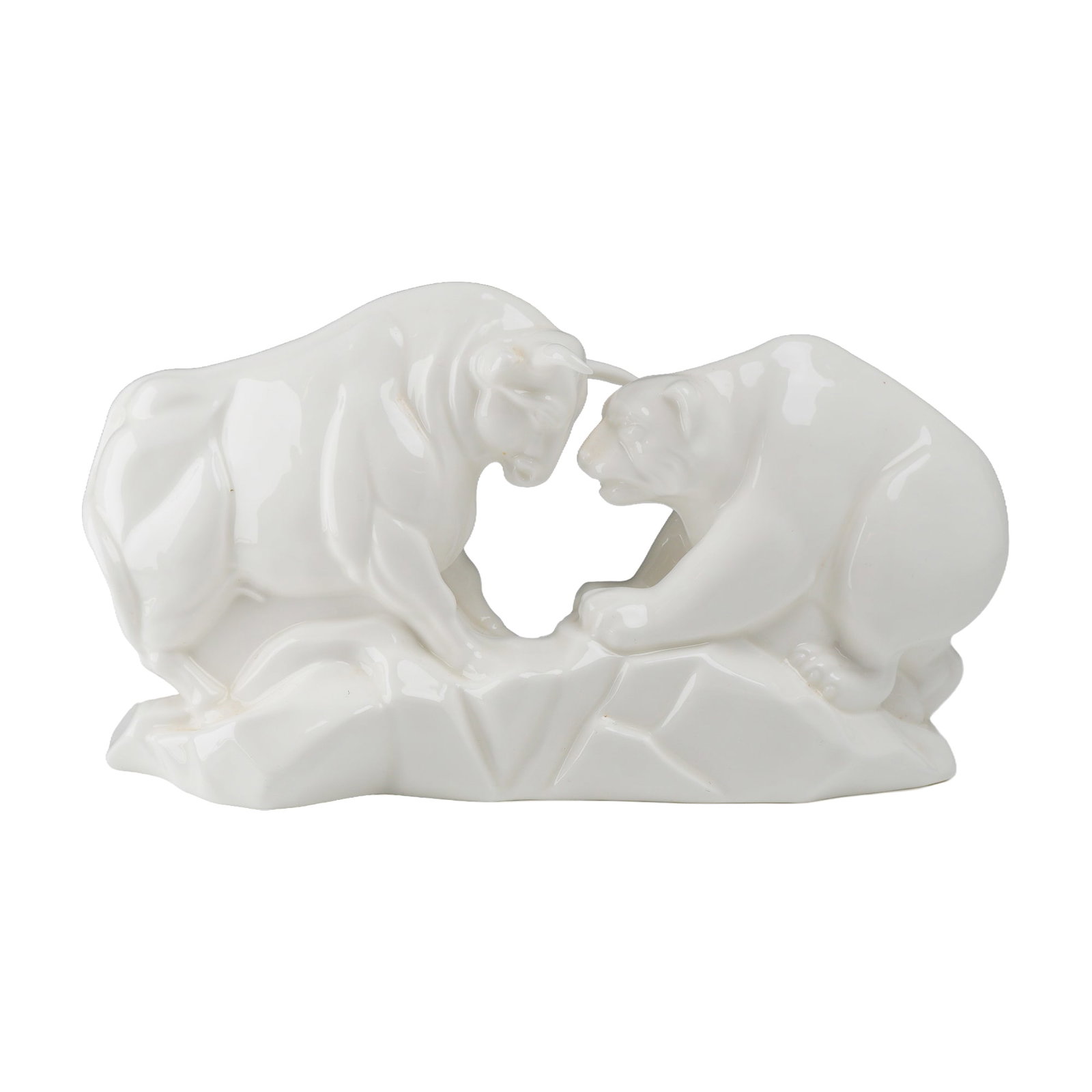Wedgwood Bone China Bull and Bear Figurine: This Wedgwood bone china figurine depicts the stock market symbols of a bull and a bear in a face-to-face confrontation. The figures are modeled in a stylized, geometric fashion on a rocky, angular ba