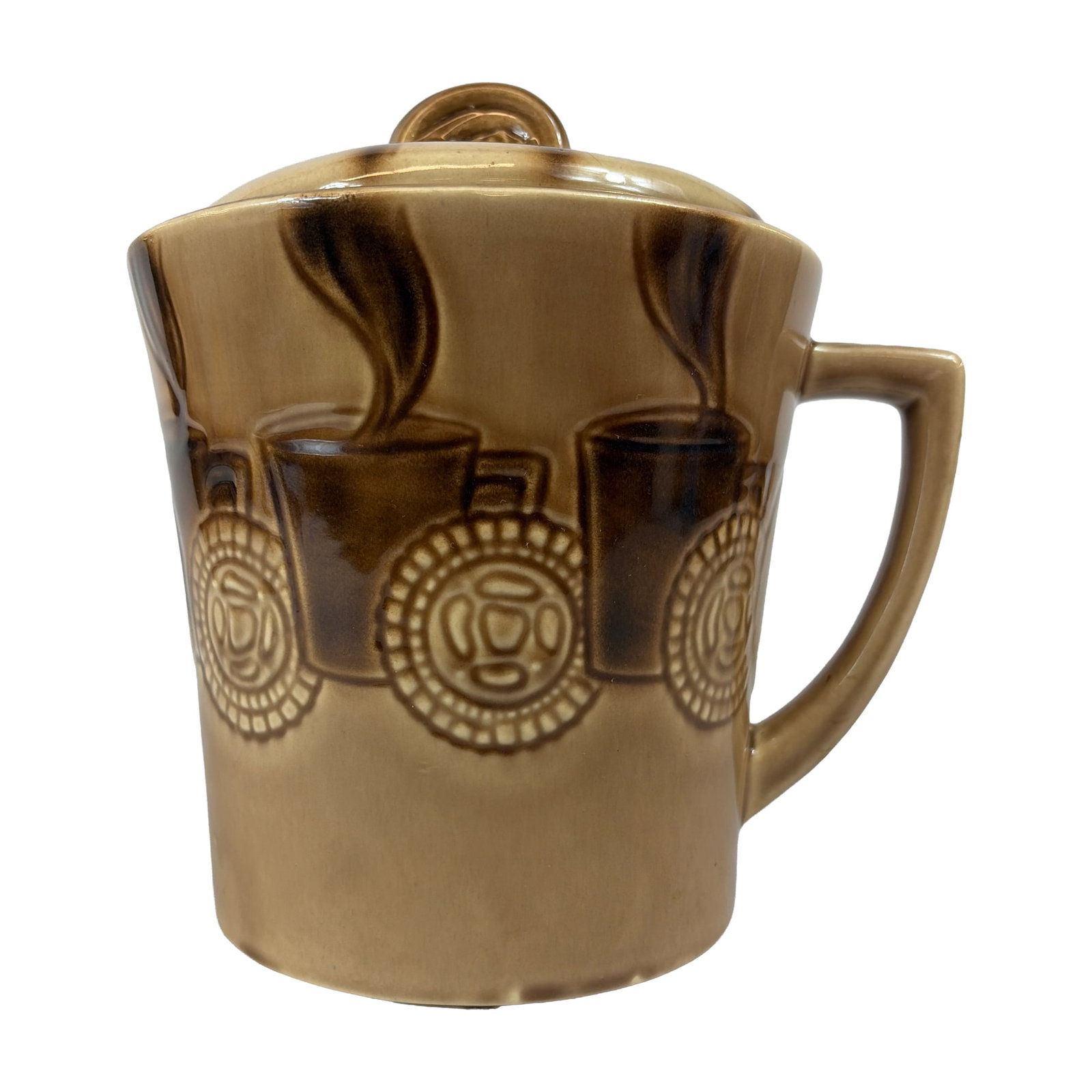 McCoy Ceramic Coffee Mug Cookie Jar: The cylindrical vessel is rendered in glazed earthenware with a two-tone tan and brown high-gloss finish. The exterior features a molded relief pattern known as the coffee cup pattern, depicting styli