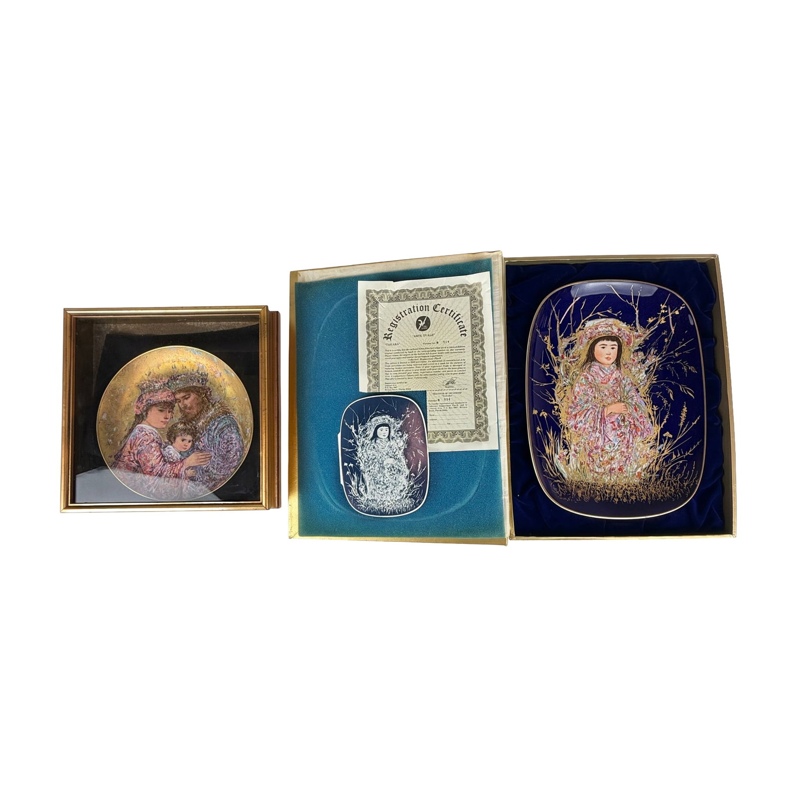Two Edna Hibel Limited Edition Porcelain Plates Including Boxed Takara Arte Ovale and Framed Family: This lot features two limited-edition decorative porcelain items by the American artist Edna Hibel (1917??"2014). The first item is a large oval-shaped porcelain plate from the Prima Arte Ovale series