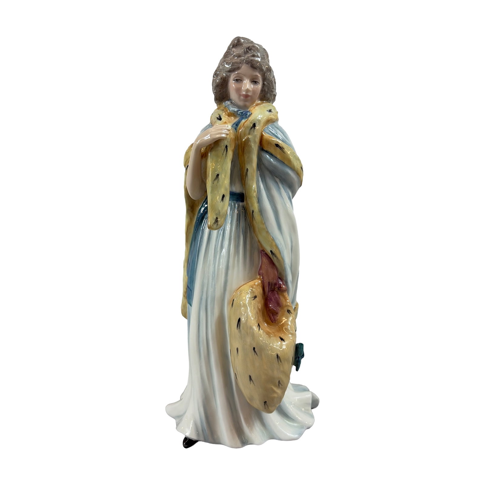 Royal Doulton Bone China Figurine, Eliza Farren HN3442: The figure is depicted in late 18th-century attire, featuring a flowing pale blue and white gown with an ermine-trimmed stole and matching large fur muff. The design is inspired by the 1790 portrait o