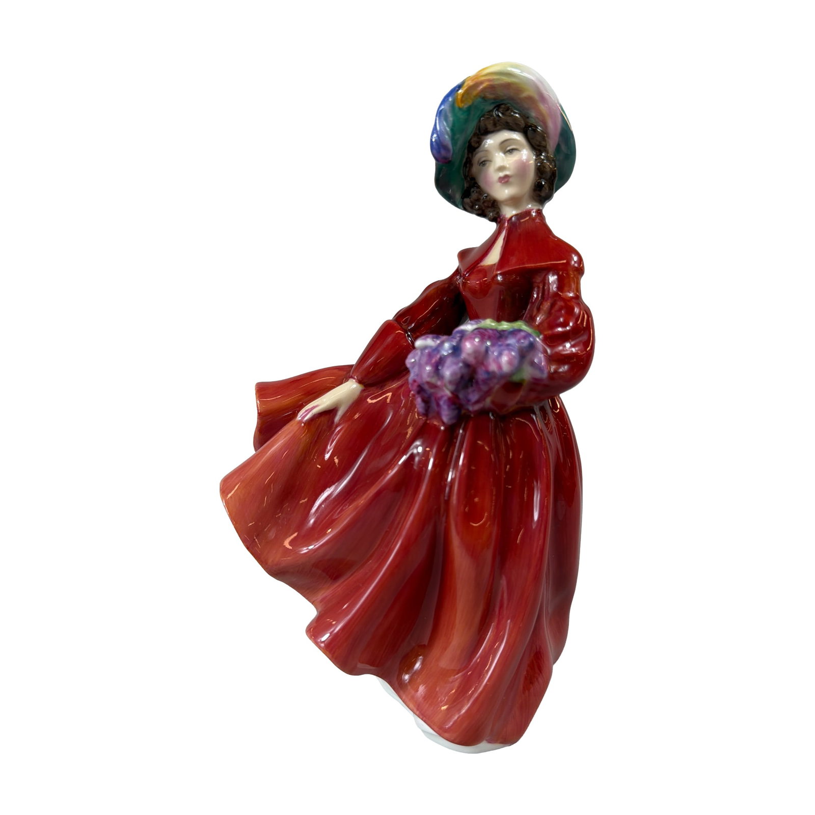 Royal Doulton Lilac Time Porcelain Figurine HN2137: Royal Doulton glazed bone china figurine titled Lilac Time, model HN 2137, designed by Margaret Davies. The figure depicts a standing woman in a voluminous red gown wearing a colorful bonnet in shades