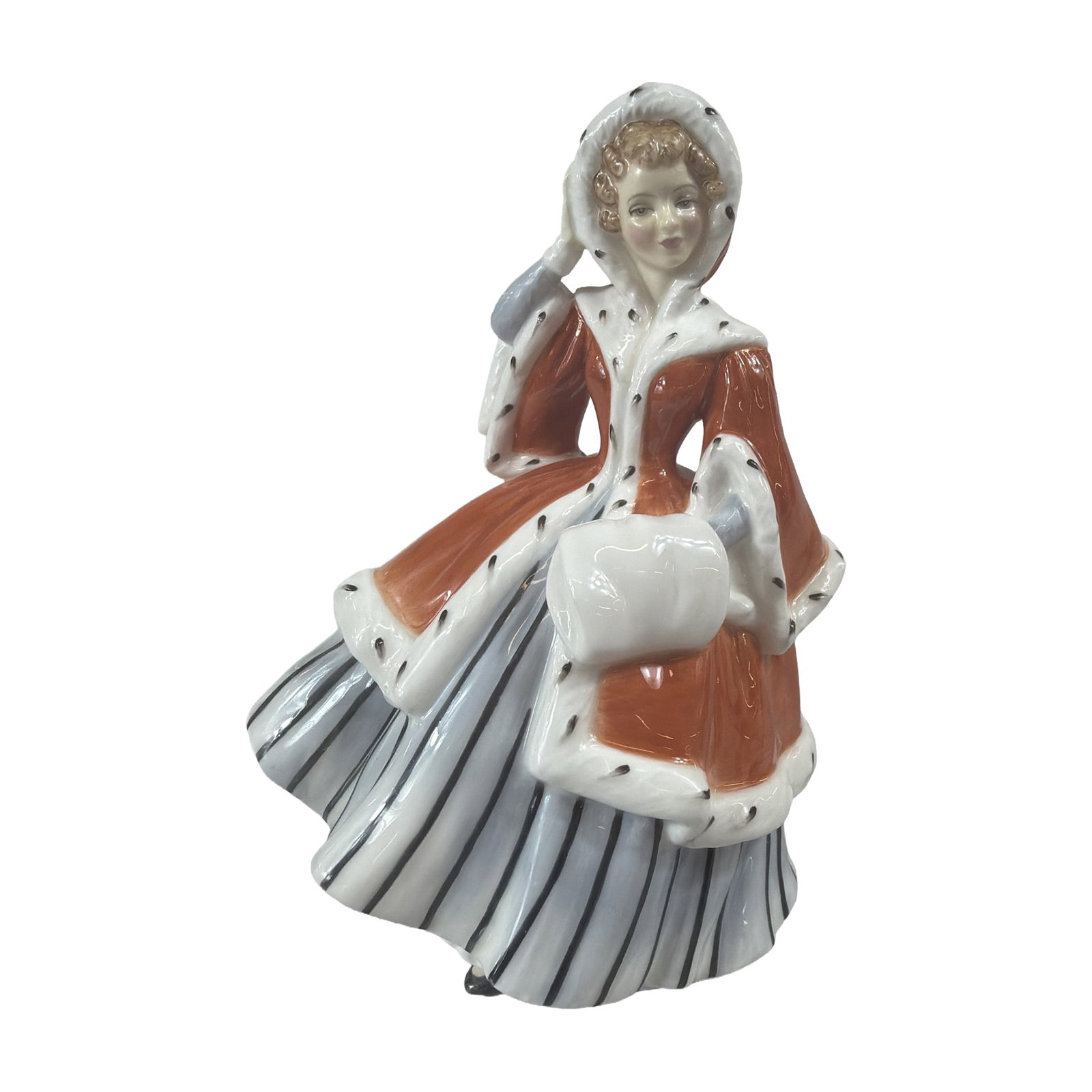 Royal Doulton Noelle Porcelain Figurine HN2179: Royal Doulton glazed bone china figurine titled Noelle, model HN 2179, copyrighted in 1956. The female figure is modeled in winter attire, featuring a hooded rust-orange coat trimmed with white and bl