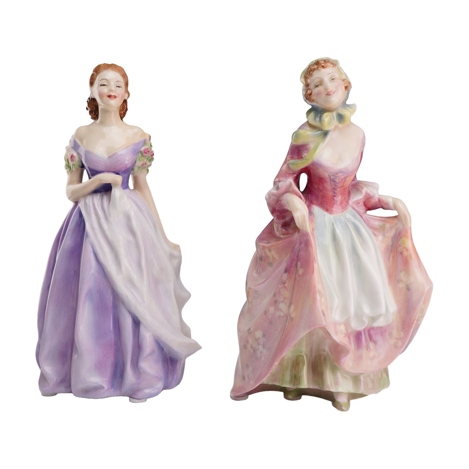 Two Royal Doulton Figurines, Jacqueline HN 2000 and Suzette HN 2026: The first figurine, titled Jacqueline (model HN 2000), depicts a woman in a purple and lavender gown with hand-painted floral accents on the sleeves and auburn hair. The second figurine, titled Suzett