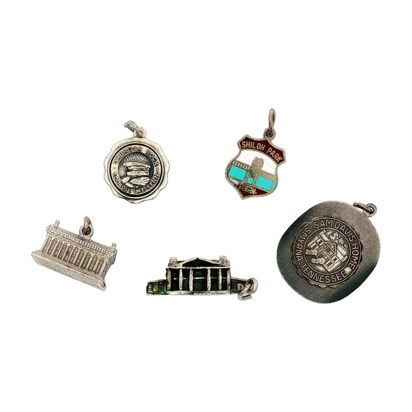 5pc Sterling and Non-Sterling Silver Tennessee Charms: A group of silver charms featuring Tennessee landmarks. The set includes charms modeled after the Parthenon and the Hermitage, as well as charms for Shiloh Park, Umbrella Rock, and the Sam Davis House