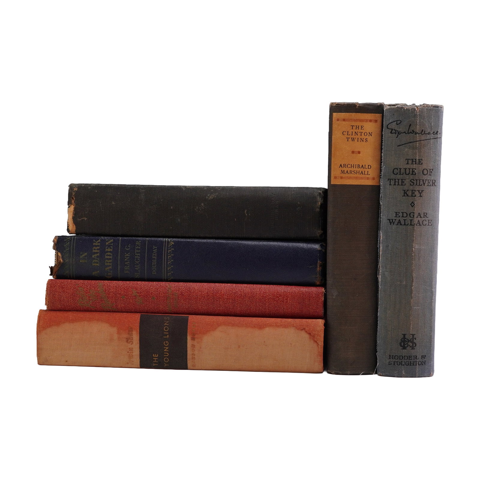 6pc Hardcover Fiction Books, The Young Lions, The Clue of the Silver Key, and More: A collection of 6 hardcover books comprising mid-20th-century fiction. The lot includes The Young Lions by Irwin Shaw; In a Dark Garden by Frank G. Slaughter (Doubleday); Ridin' the Rainbow by Rosemar
