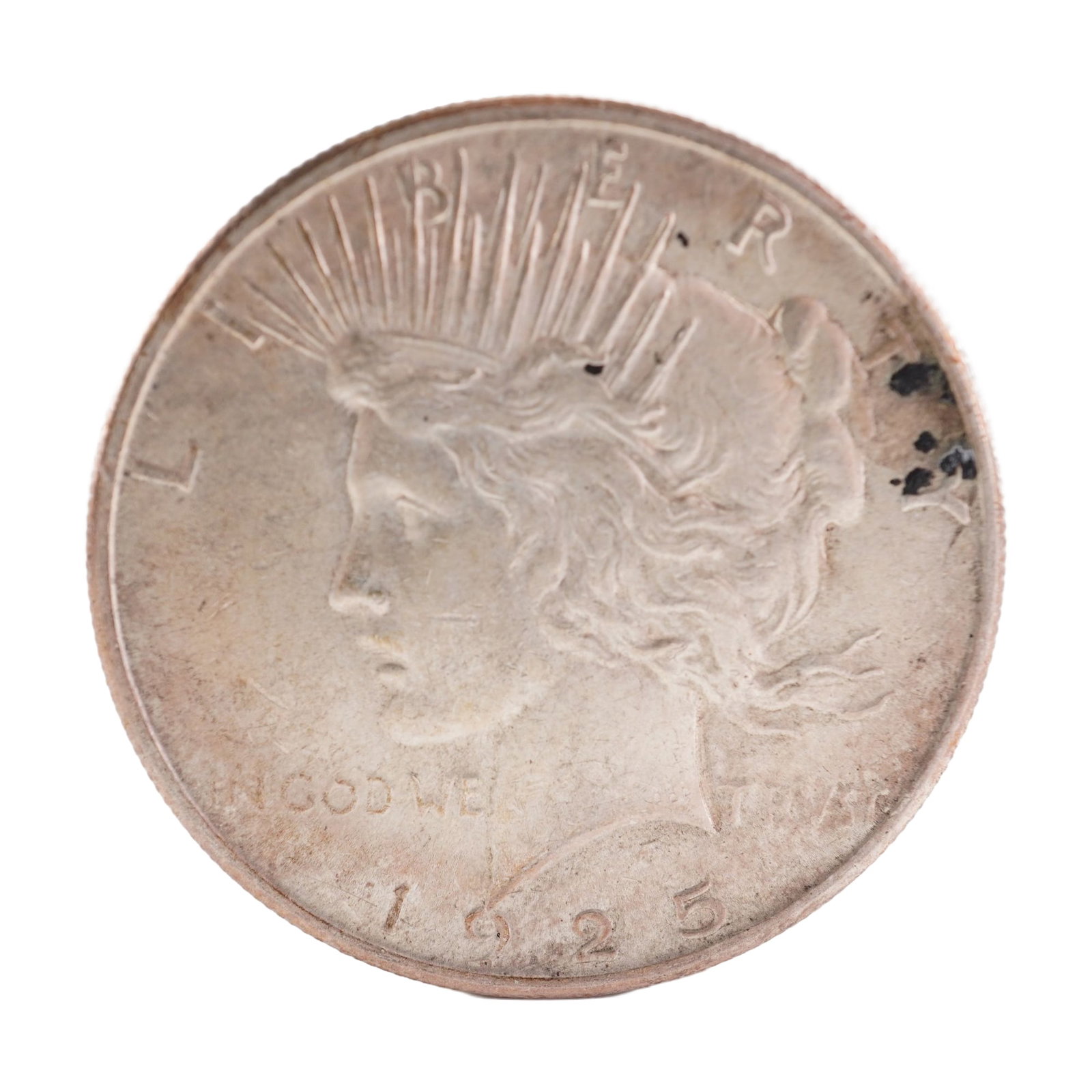 1925 U.S. Peace Dollar 90% Silver Coin, Circulated: Peace dollar designed with obverse capped head of Liberty facing left with headband rays. Reverse has Eagle standing right on rock with wings folded, branch in talons, rays behind and PEACE below. Tot