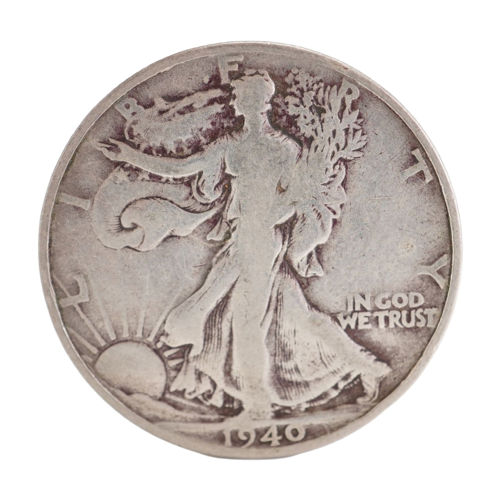 1940 U.S. Walking Liberty Half Dollar 90% Silver Coin, Circulated: Design includes obverse Liberty walking to the left with date below; Reverse has Eagle with wings spread and denomination below. Total weight 12g. Dimensions: 30.6mm Date or Era: 1940 Country of Origi