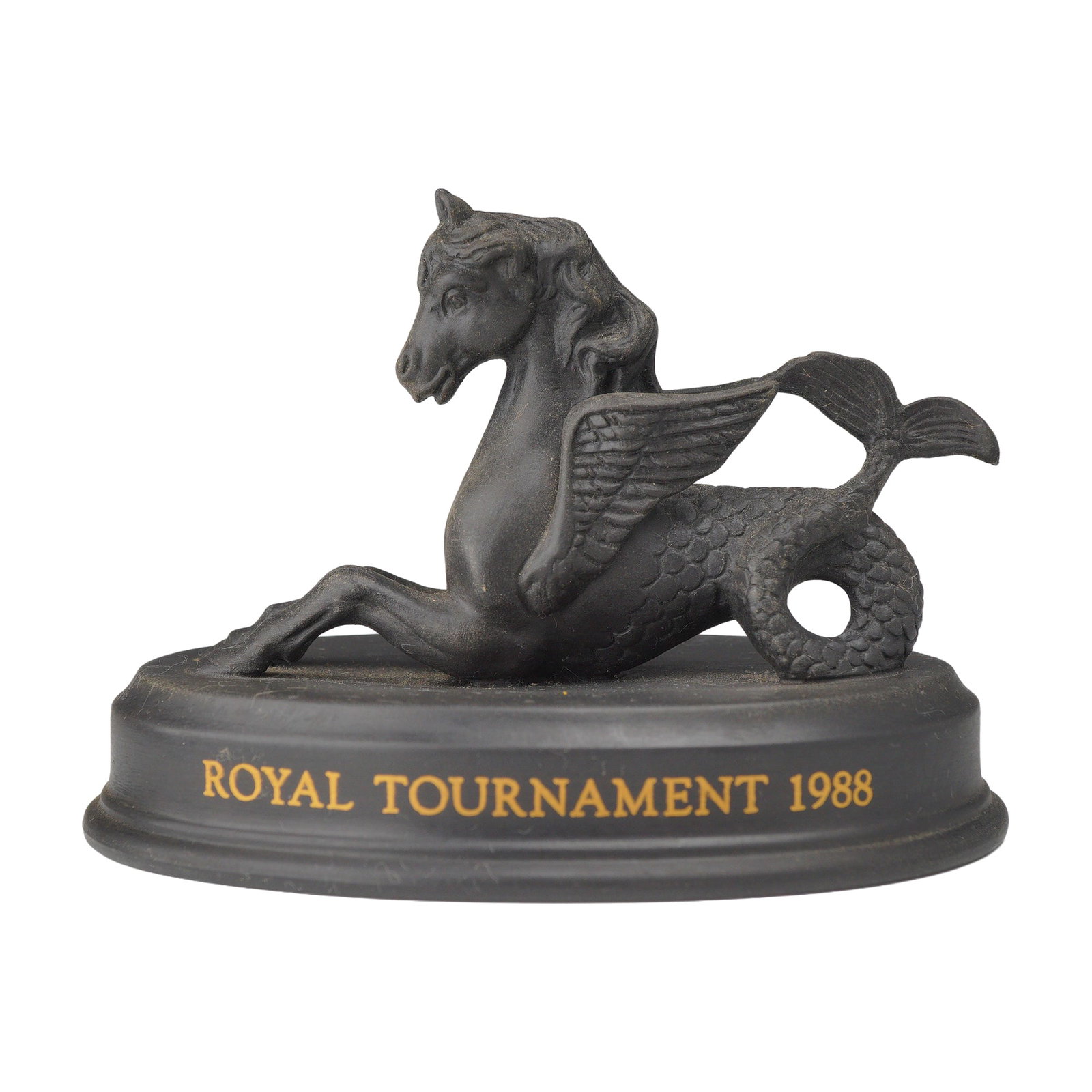 Wedgwood Black Basalt Winged Hippocampus Figurine for Royal Tournament 1988: A Wedgwood black basalt figurine of a winged hippocamp, a mythological sea-horse, produced as a commemorative piece for the 1988 Royal Tournament. The figure is crafted from matte black stoneware and 