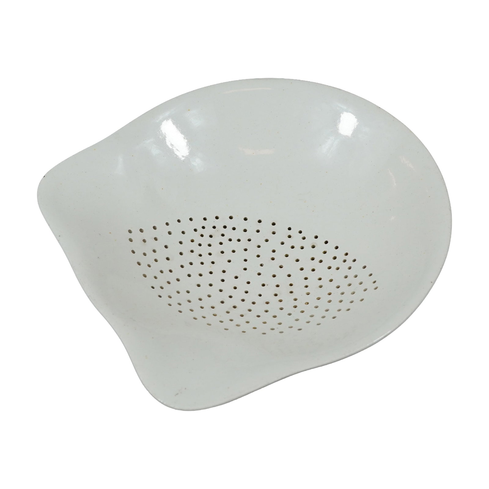 Mid-Century Modern White Glazed Ceramic Teardrop Form Colander: A white-glazed ceramic colander or strainer insert featuring a shallow, asymmetrical teardrop silhouette. The piece is characteristic of mid-20th-century biomorphic design. The interior is pierced wit