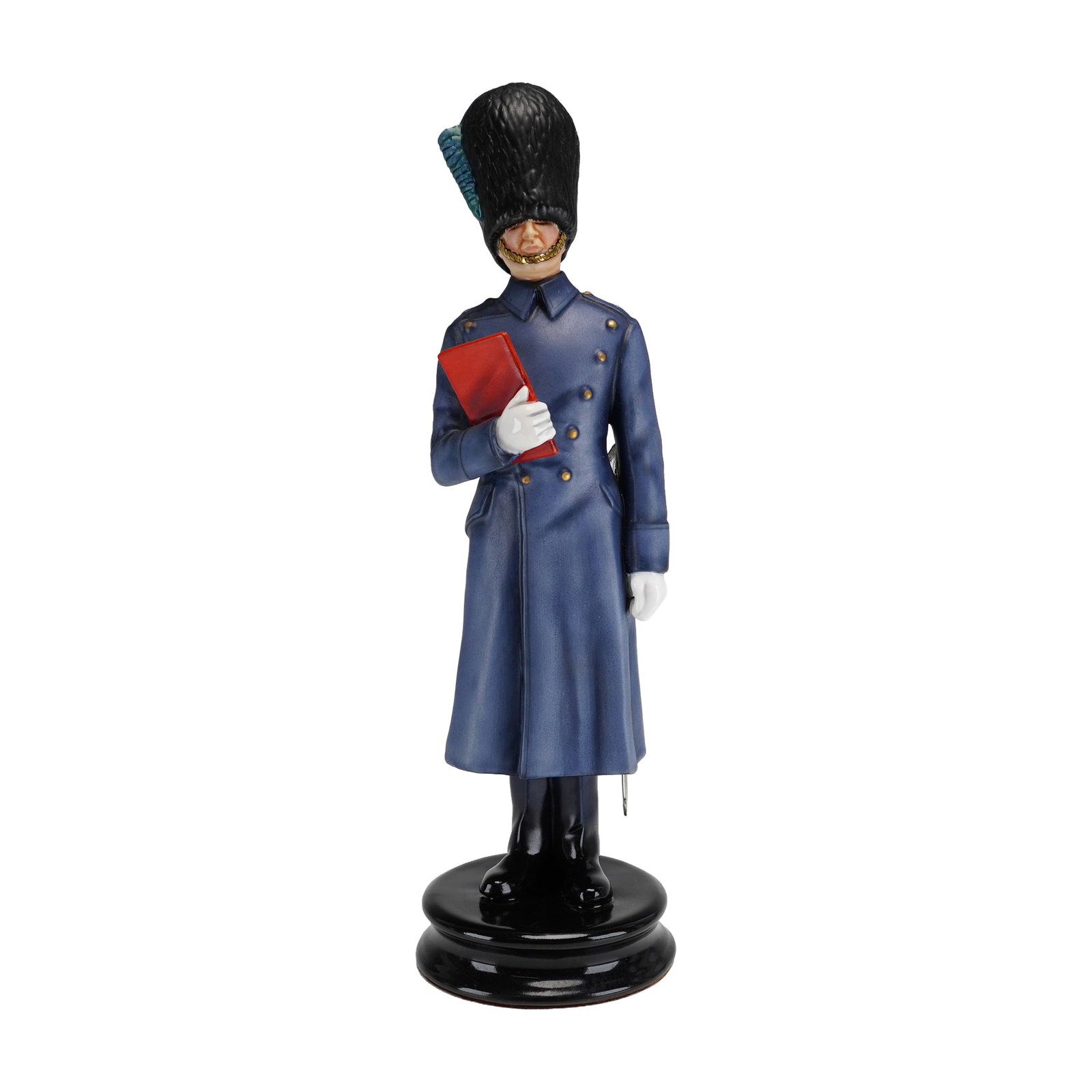 Michael Sutty Porcelain Figurine, Irish Guards: Hand-painted figure of an Irish Guardsman presented in full ceremonial winter dress, wearing a long double-breasted greatcoat and bearskin hat with plume. The figure is shown holding the St James's Pa