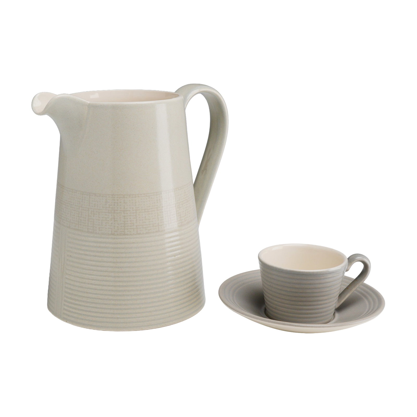 A Trio of Wedgwood Paul Costelloe Limestone Pattern Stoneware Tableware Items: This group of contemporary ceramic tableware was designed by Paul Costelloe for Wedgwood in the Limestone pattern. The trio consists of a large pitcher, a small cup, and a matching saucer. Constructed