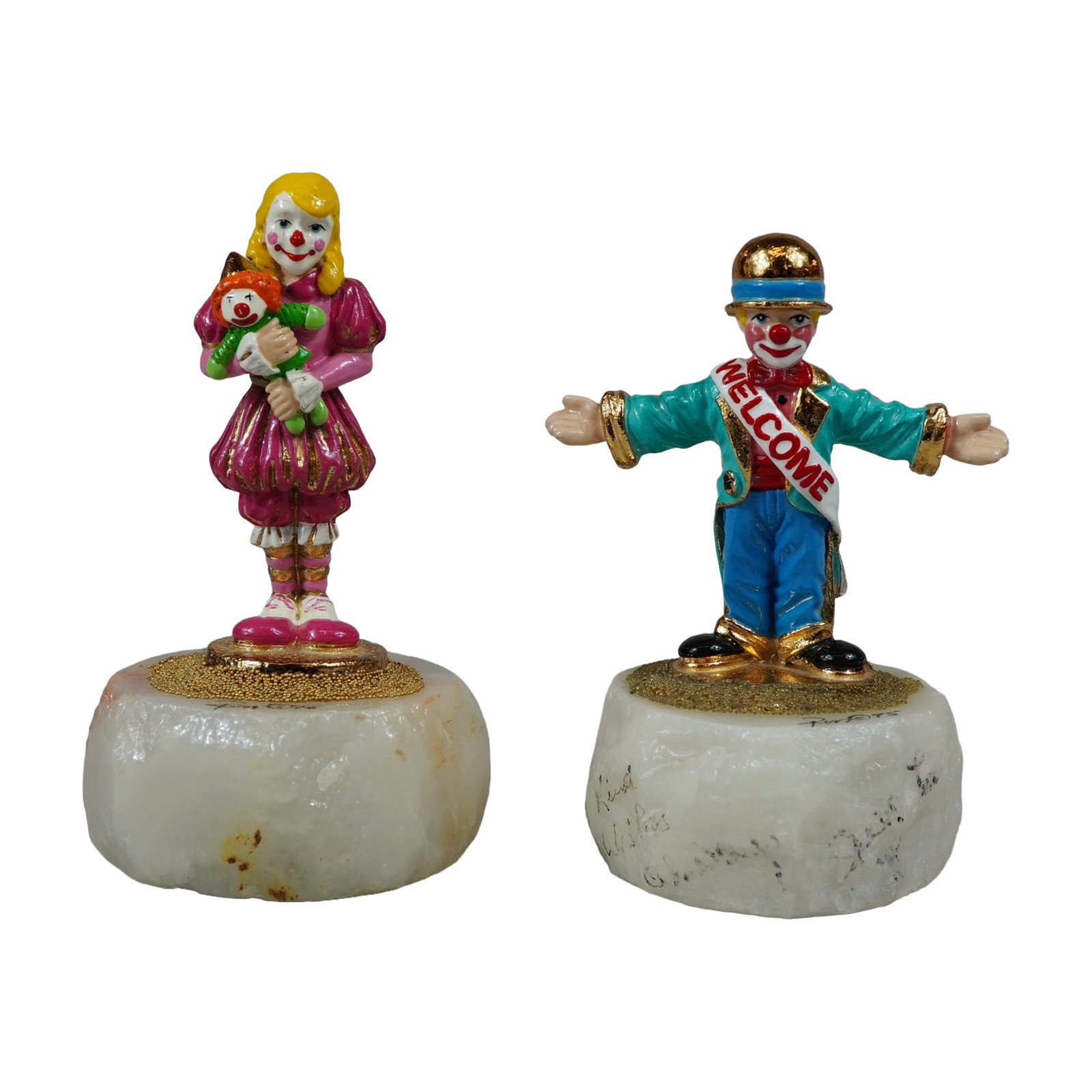 2pc Ron Lee Signed Cast Metal Clown Sculptures: Ron Lee (American, 1947-2017). Pair of hand-painted cast metal clown sculptures with 24 karat gold-plated accents, each mounted on a natural translucent white stone base with a gold-toned bead surroun