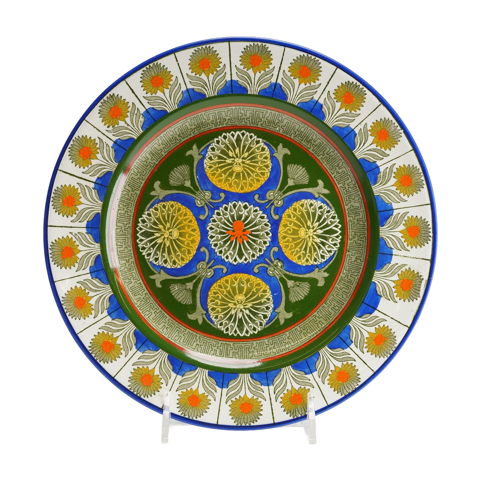 Wedgwood Creamware Plate, Marigold: The decoration is executed in polychrome enamel over a transfer-printed base. The design features bold colors, predominantly green, blue, yellow, and orange, executing complex geometric and stylized m