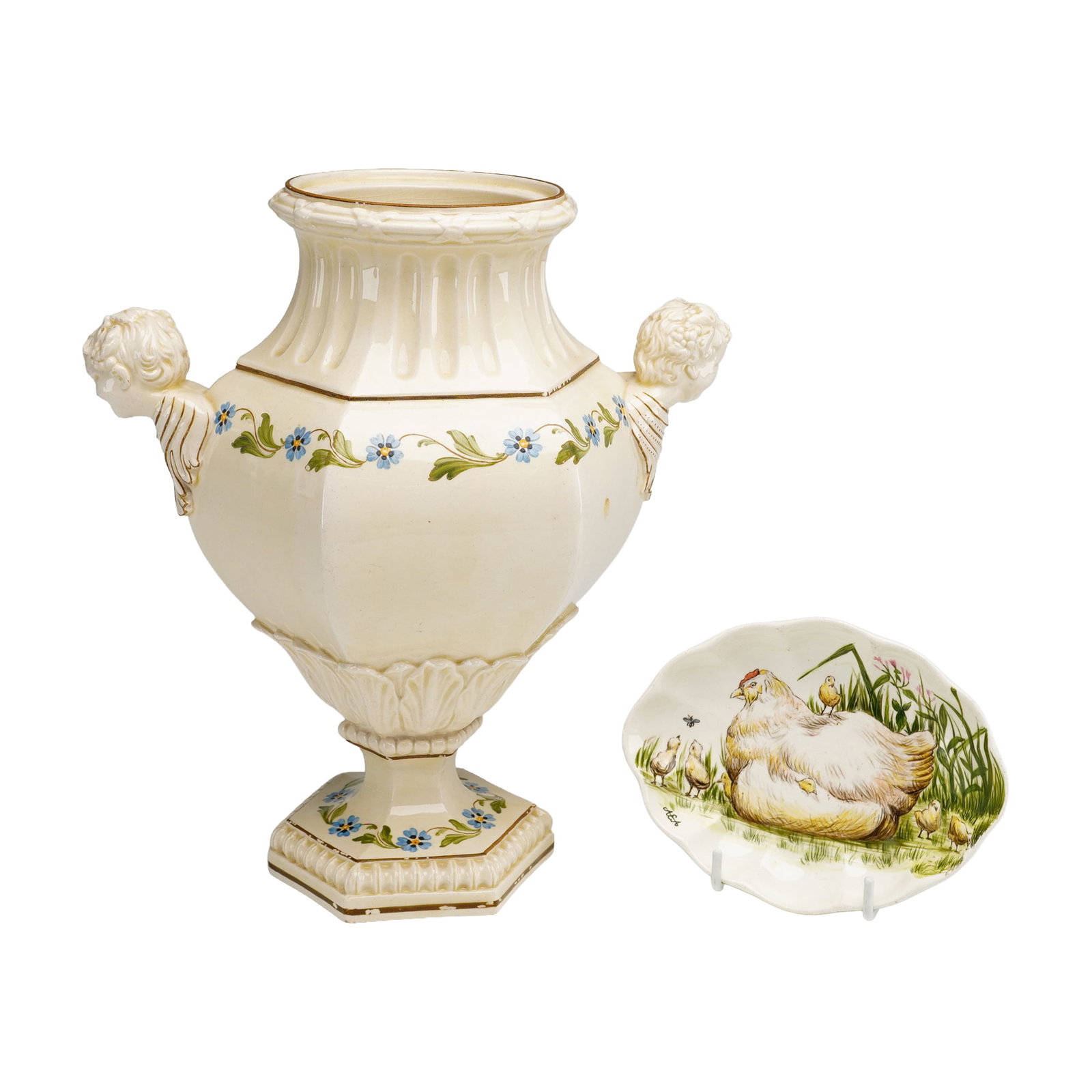 2pc Wedgwood Figural Handles Etruria Vase and Hand-Painted Hen Dish: This lot features two ceramic pieces including a large Wedgwood glazed earthenware urn and a hand-painted dish. The hexagonal urn, crafted in the Queen's ware or creamware style, features a fluted fla