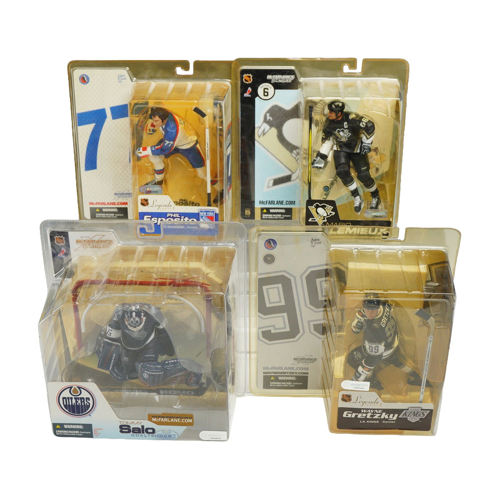 4 McFarlane Toys NHL Sportspicks Action Figures in Original Packaging: A collection of 4 collectible NHL hockey action figures produced by McFarlane Toys as part of the McFarlane's Sportspicks line. Each figure is housed in its original blister packaging and includes a d