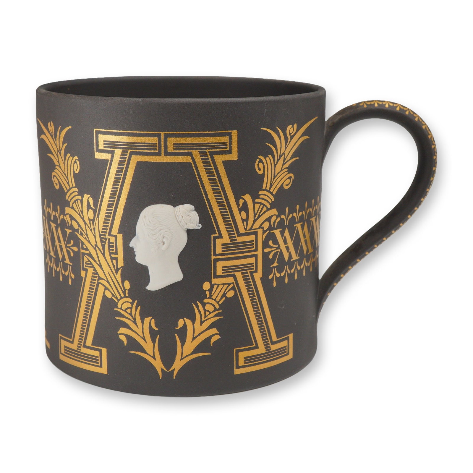 Wedgwood Black Basalt Victoria and Albert Limited Edition Commemorative Mug: A Wedgwood black basalt stoneware cylindrical mug with a single loop handle, part of the Rubin Collection. The body features two applied white bas-relief jasperware cameo portraits in profile depictin
