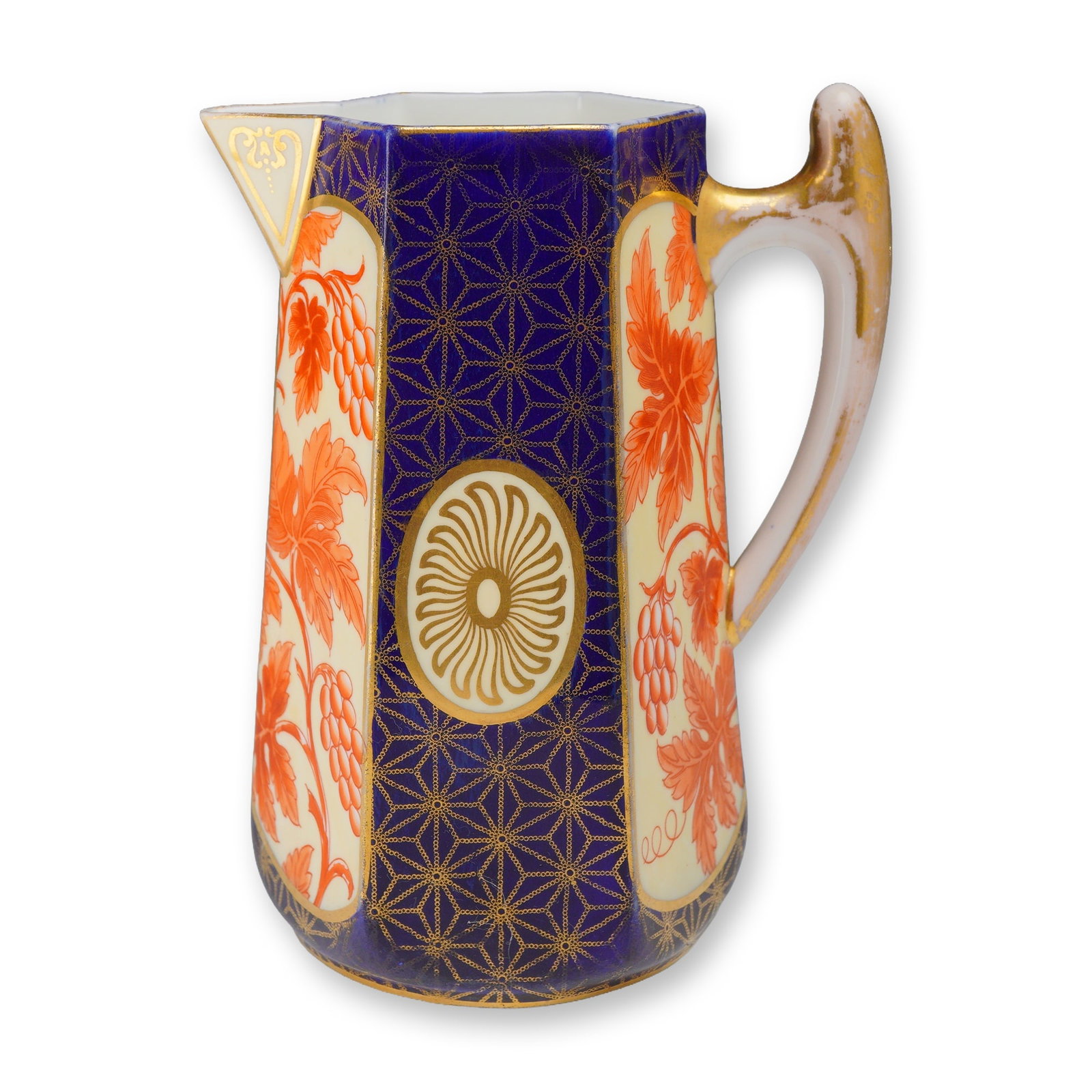 Wedgwood Aesthetic Movement Porcelain Hexagonal Pitcher with Grapevine Decoration: This Wedgwood porcelain pitcher features a tapered hexagonal form characteristic of late 19th-century Aesthetic Movement design. The exterior decoration is divided into eight alternating vertical sect