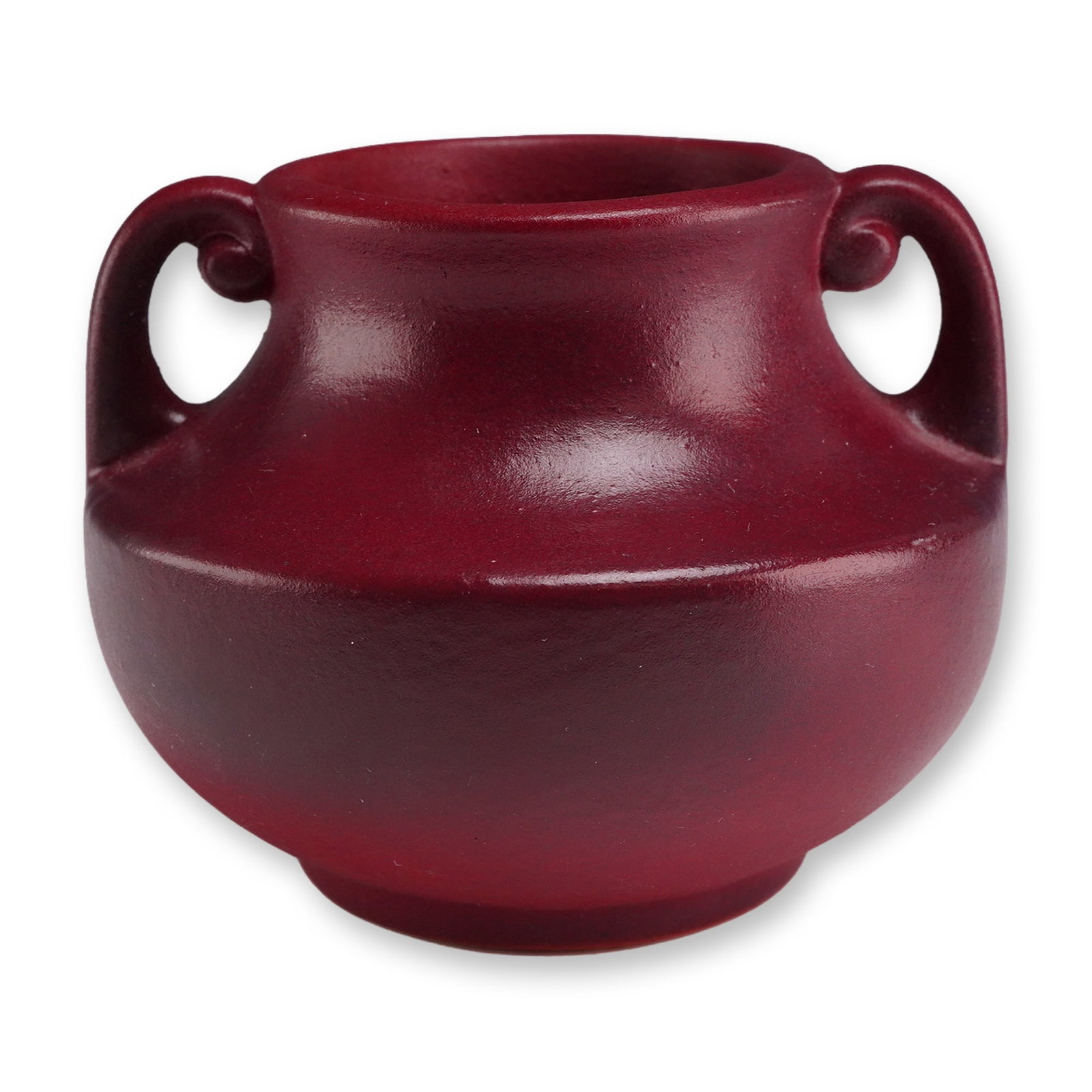 Fulper Pottery Miniature Matte Red Handled Small Vase: Fulper Pottery (American, Flemington, New Jersey). Miniature cabinet vase in stoneware featuring a squat, bulbous form with two scroll handles and a flared rim. The exterior is finished in a matte red