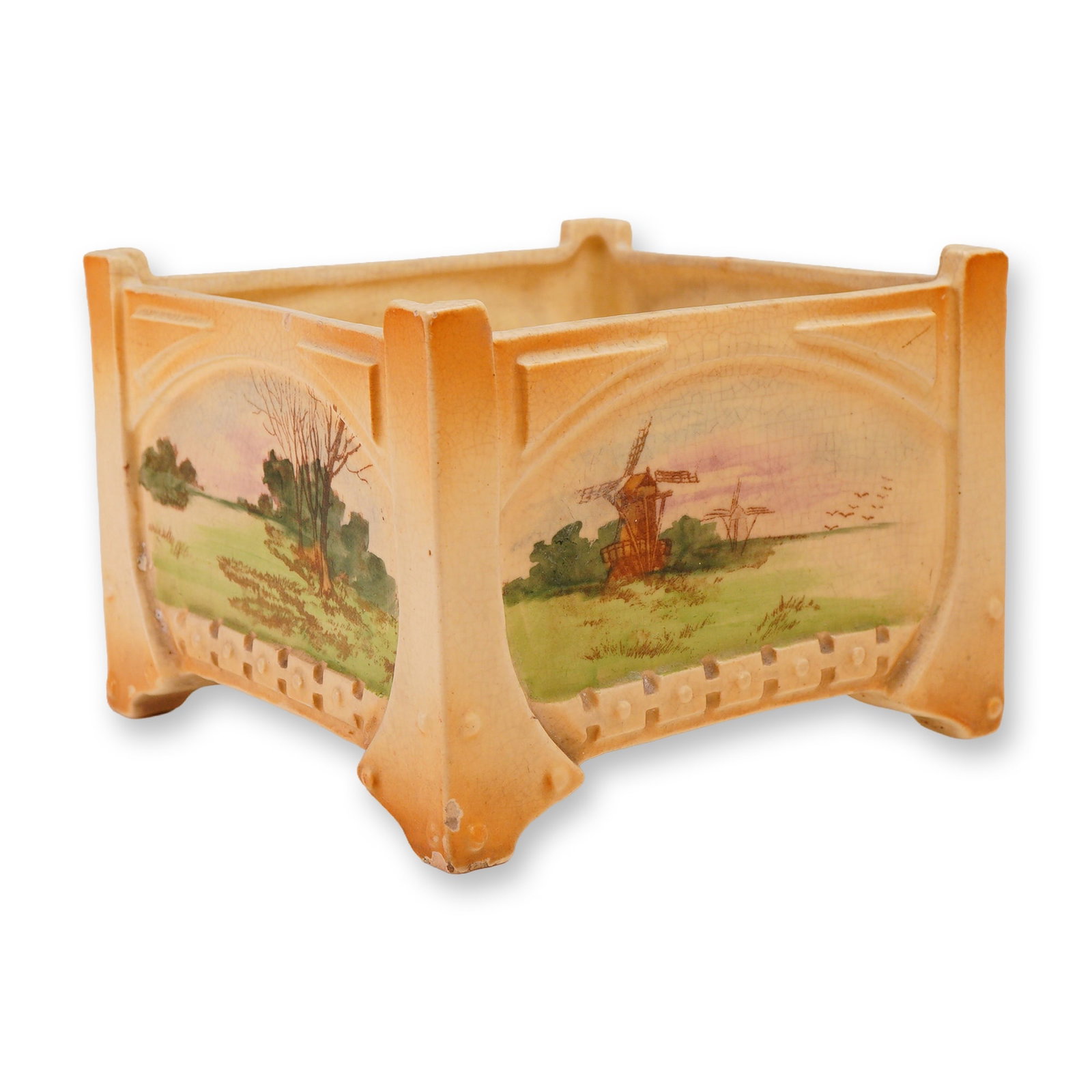 Ceramic Scenic Landscape Square Footed Planter: A vintage Art Nouveau style ceramic footed planter. This square-form vessel features a molded architectural body characterized by arch-topped panels on each face. The exterior is finished in a shaded 