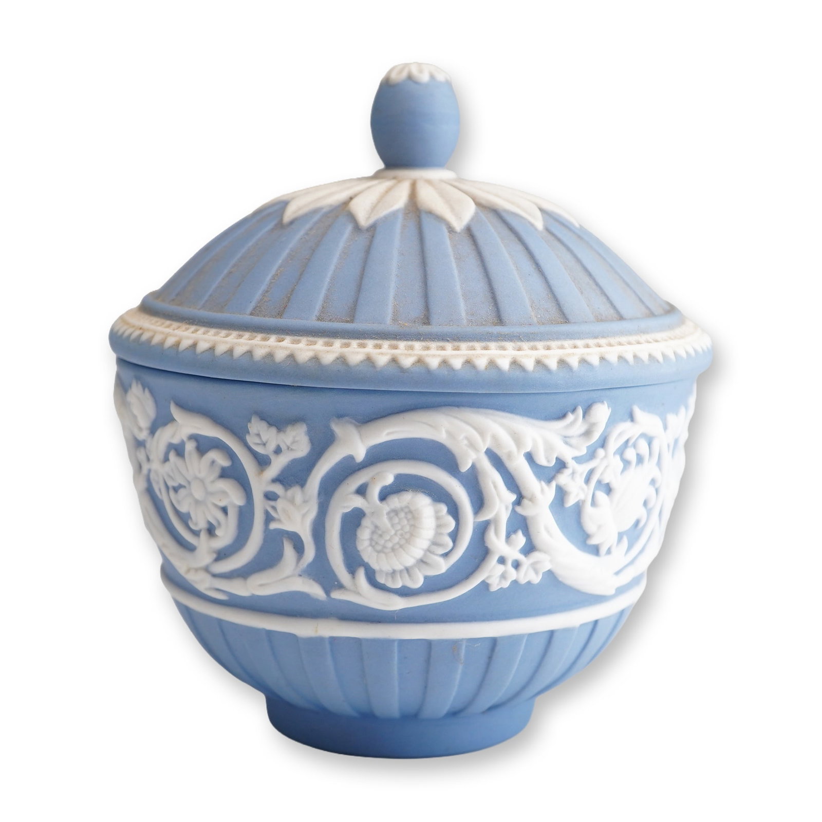 Wedgwood Pale Blue Jasperware 250th Anniversary Lidded Sugar Bowl: This lidded ceramic sugar bowl, or sucrier, is a piece of Wedgwood jasperware produced to commemorate the company's 250th anniversary. Constructed from light blue stoneware with a matte finish, the pi