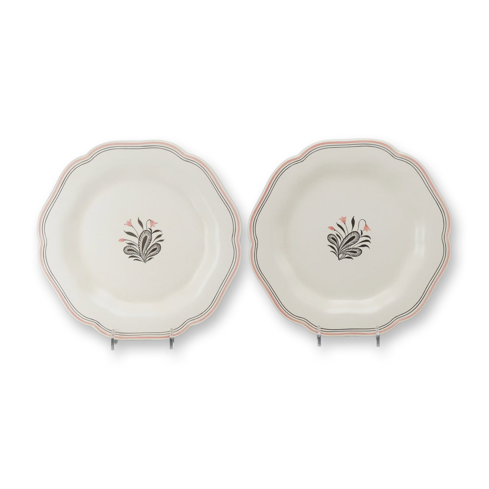 2pc Wedgwood Moonstone Pattern Scalloped Octagonal Plates: A pair of octagonal earthenware plates featuring a scalloped rim, finished in a matte cream-colored glaze known as Moonstone. Each plate is decorated with a central stylized Art Deco floral motif cons