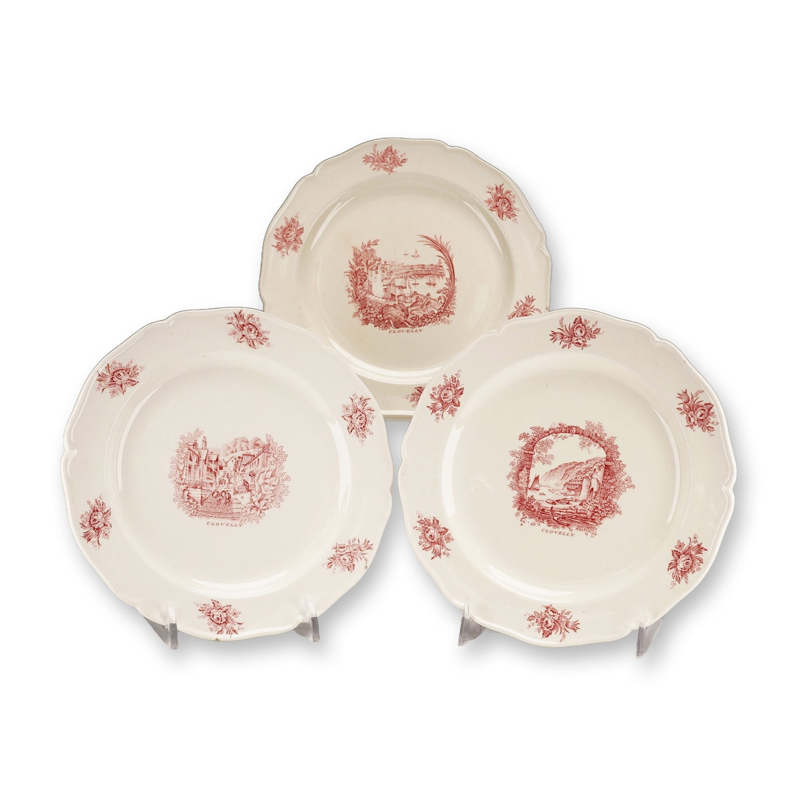 Three Wedgwood 'Clovelly' Plates Designed by Rex Whistler: A set of three Wedgwood 'Clovelly' pattern plates, designed by Rex Whistler. Each ceramic plate features a scalloped rim and is decorated with red transferware on an off-white ground. The border displ