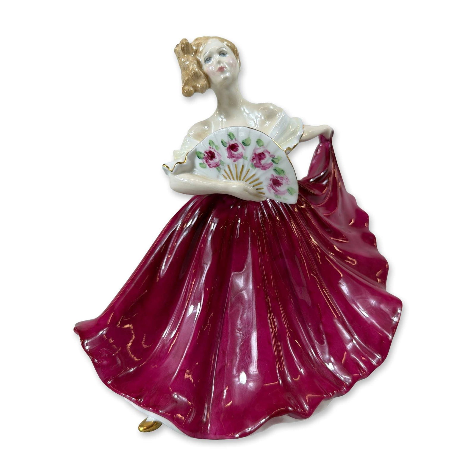 Royal Doulton Bone China Figurine Elaine HN 3741: Royal Doulton porcelain figurine titled Elaine, model HN 3741. This bone china figure, originally modelled by Peggy Davies, depicts a woman in a dynamic pose wearing a voluminous deep magenta glazed g